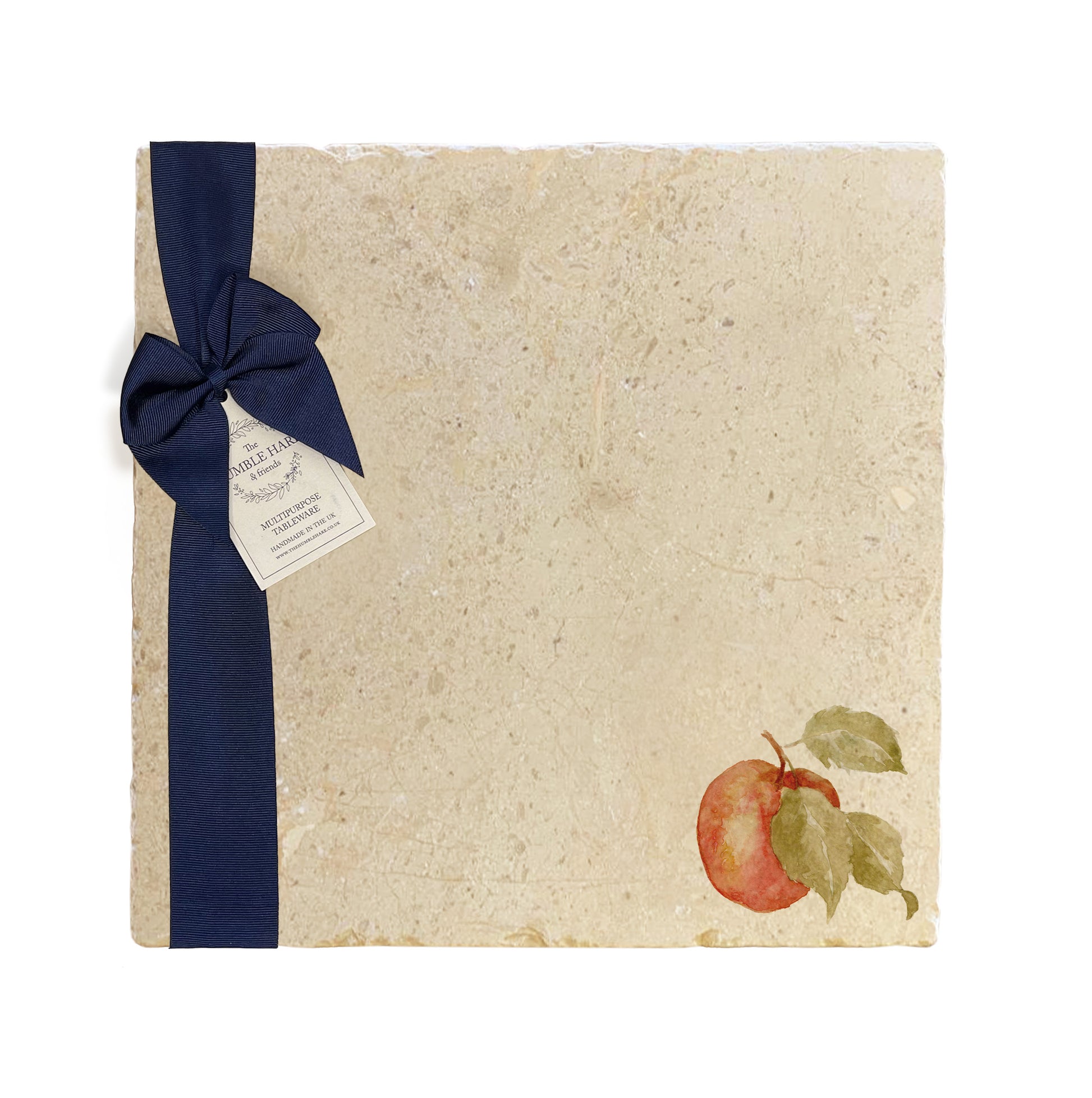 A large multipurpose marble platter with a watercolour apple design, packaged with a luxurious dark blue bow and branded gift tag.