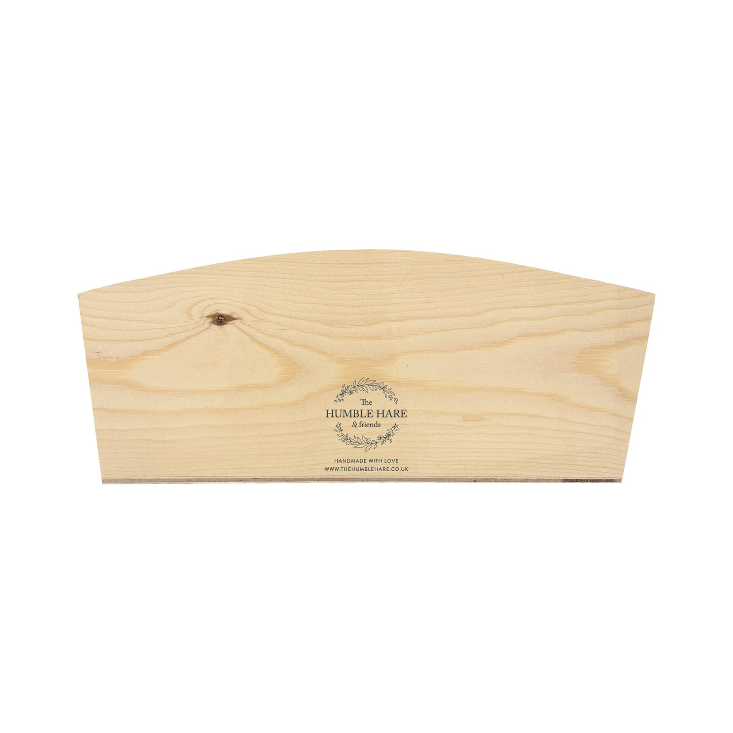 The back of an arched wooden planter box showing The Humble Hare logo is placed in the centre at the bottom.