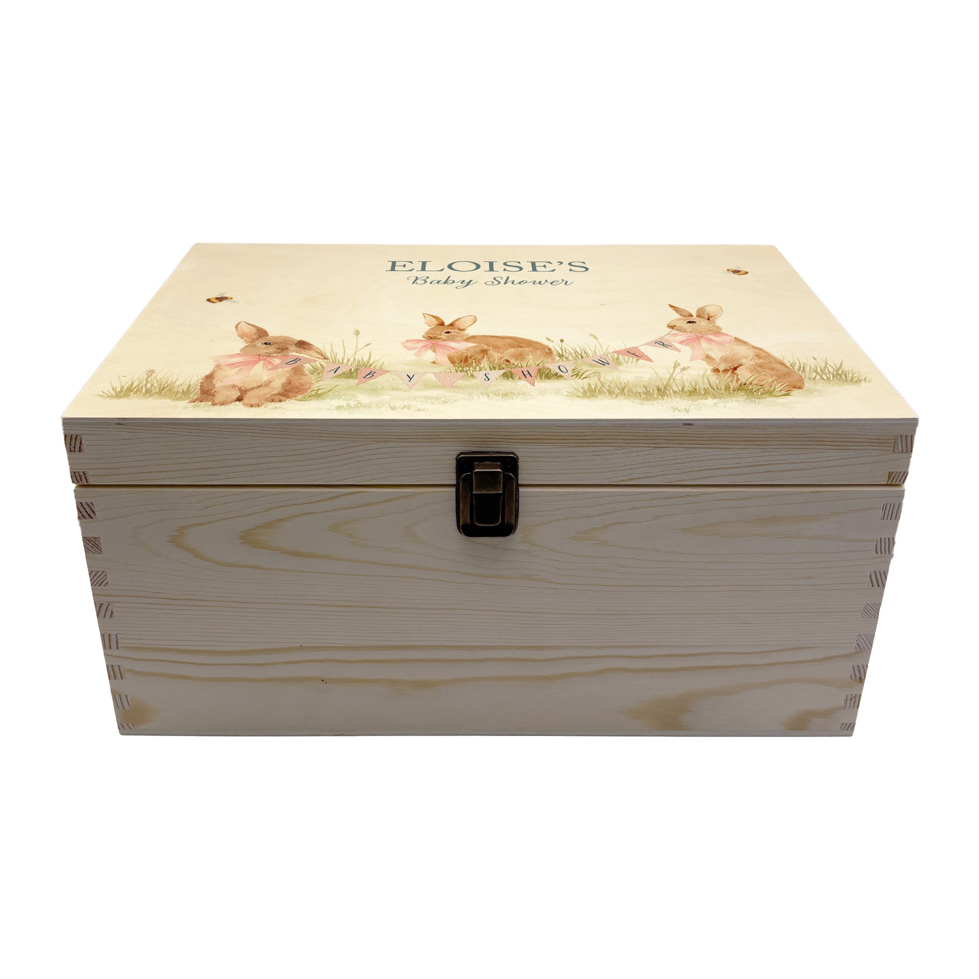 Large sized wooden pine personalised keepsake box. The design theme is perfect for New babies, Welcome to the world, baby showers and christenings. This design has baby bunnies, playing in a meadow style grass and a buzzy Bee flying around. This design can be personalised by adding a beautiful bunting and a luxurious bow around their necks in blue or pink. Add the extra special touch to your special occasion.