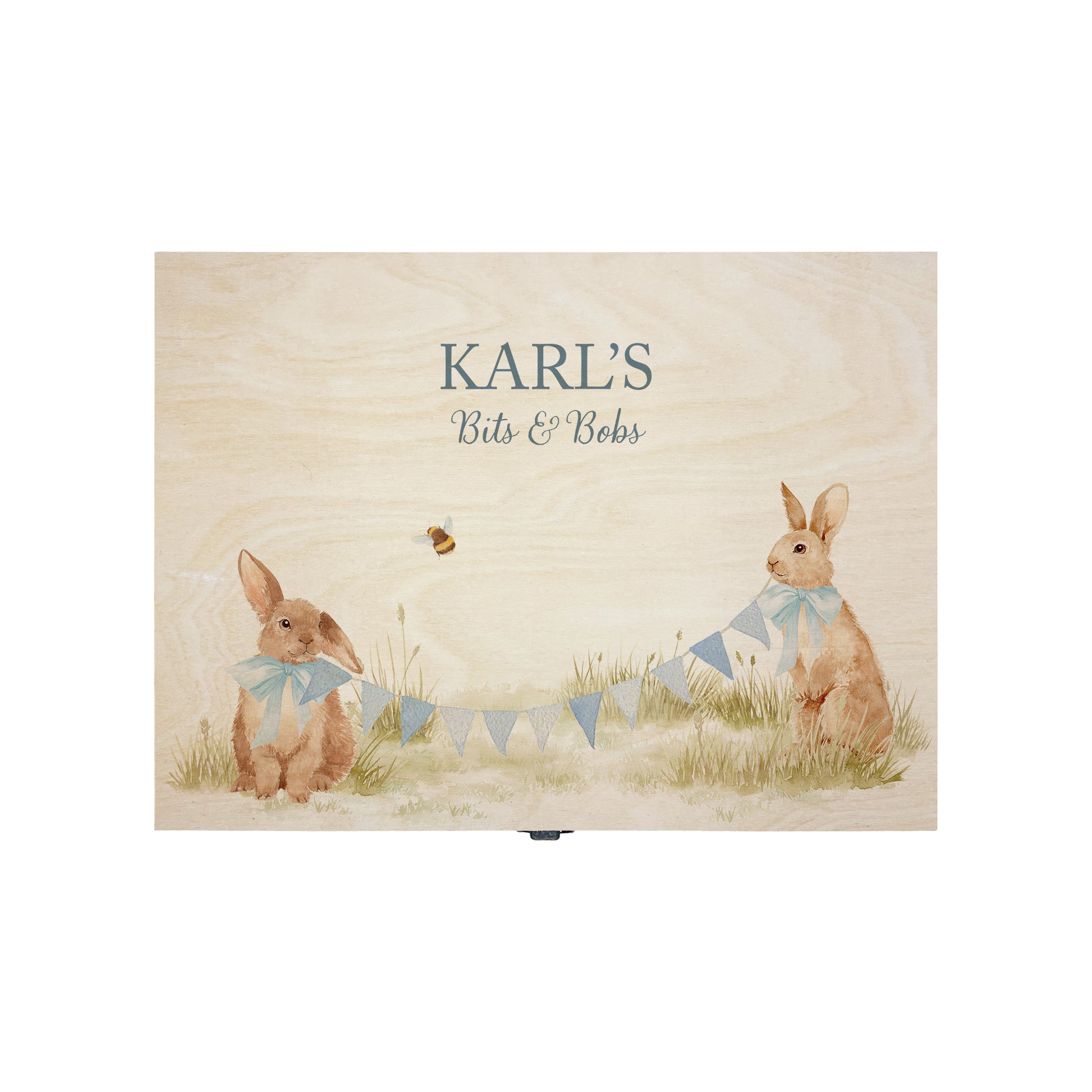 Medium sized wooden pine personalised keepsake box. The design theme is perfect for New babies, Welcome to the world, baby showers and christenings. This design has baby bunnies, playing in a meadow style grass and a buzzy Bee flying around. This design can be personalised by adding a beautiful bunting and a luxurious bow around their necks in blue or pink. Add the extra special touch to your special occasion.