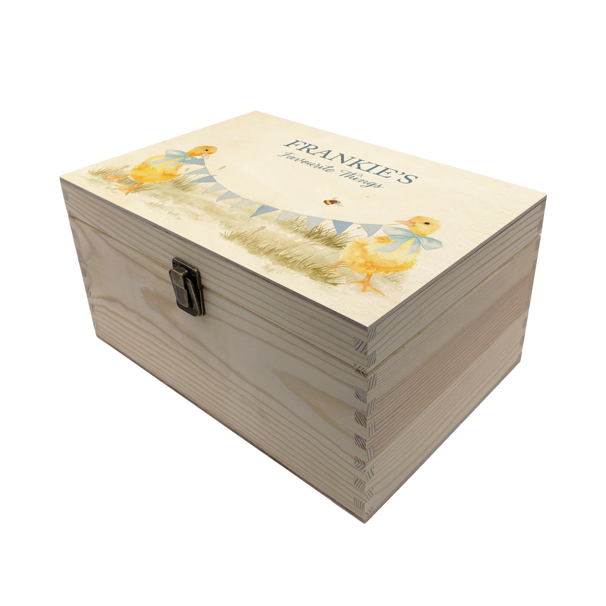 Medium sized wooden pine personalised keepsake box. The design theme is perfect for New babies, Welcome to the world, baby showers and christenings. This design has baby ducklings  in meadow style grass and a buzzy Bee flying around. This design can be personalised by adding a beautiful bunting and a luxurious bow around their necks in blue or pink. Add the extra special touch to your special occasion.