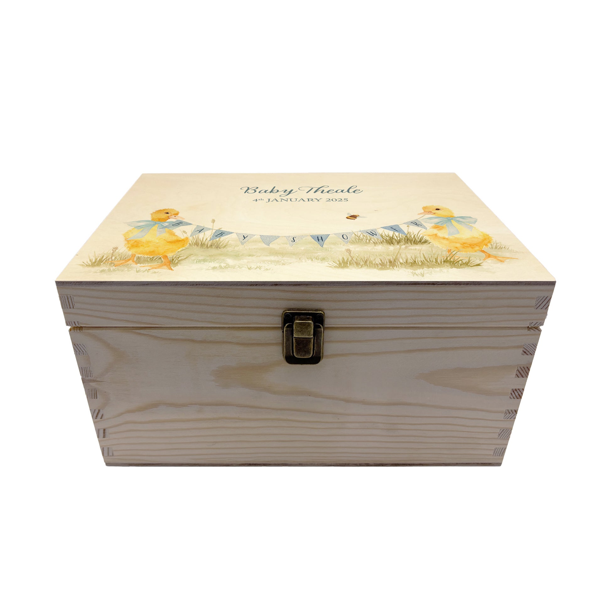 Medium sized wooden pine personalised keepsake box. The design theme is perfect for New babies, Welcome to the world, baby showers and christenings. This design has baby ducklings  in meadow style grass and a buzzy Bee flying around. This design can be personalised by adding a beautiful bunting and a luxurious bow around their necks in blue or pink. Add the extra special touch to your special occasion.