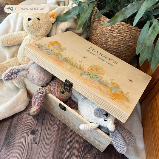 Large sized wooden pine personalised keepsake box. The design theme is perfect for New babies, Welcome to the world, baby showers and christenings. The picture also shows an example in a nursey room filled with nappies, vests and teddys.