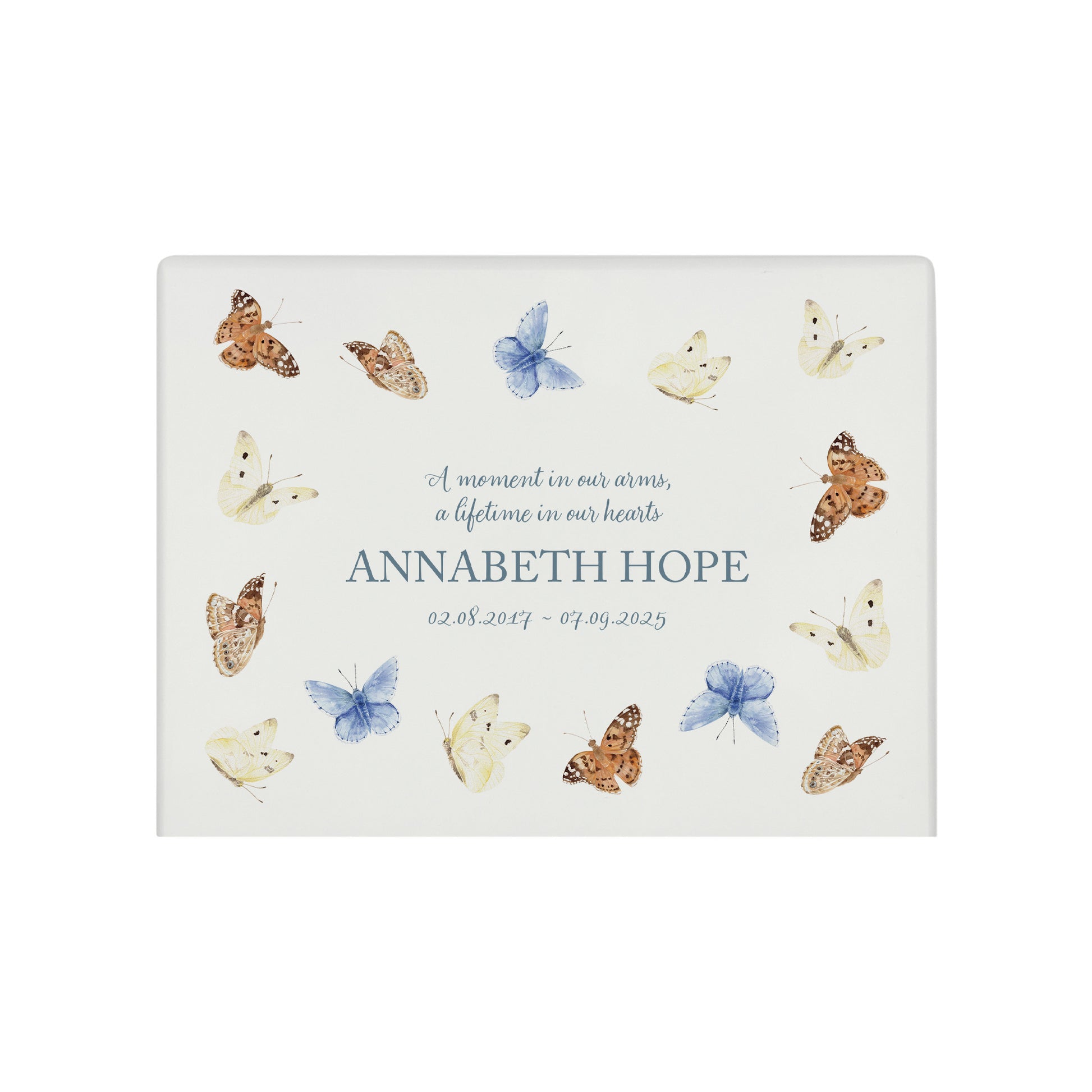 A beautifully crafted solid wooden urn, finished in white with a soft watercolour design of flying Butterflies, Thoughtfully made for either display or burial, this personalised urn can be customised to create a meaningful memorial. Perfect for holding ashes of a loved one or a beloved pet, it serves as a comforting tribute and keepsake.