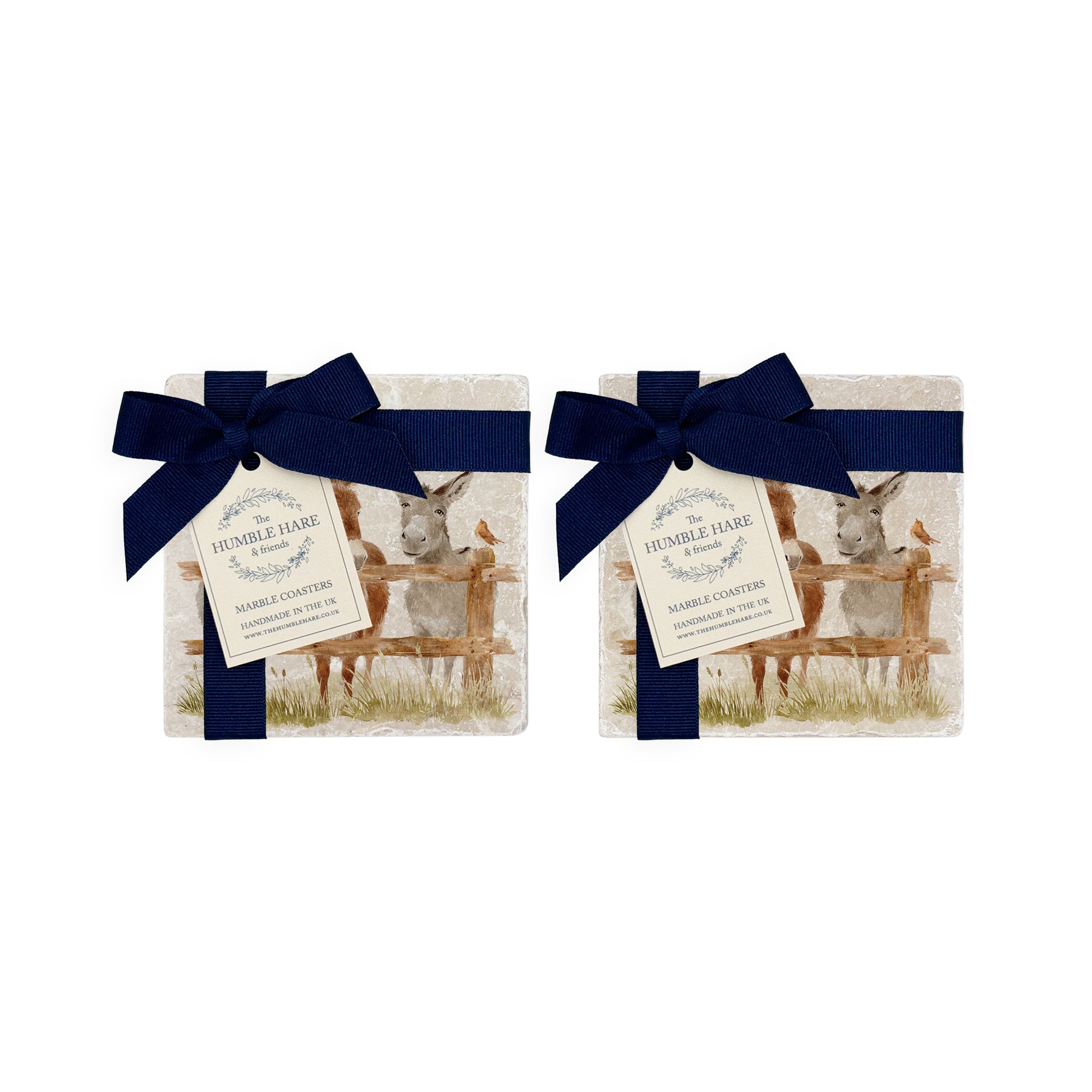 A set of 4 handmade marble coasters featuring a watercolour donkey design, packaged in 2 pairs, with a luxurious blue bow and gift tag.
