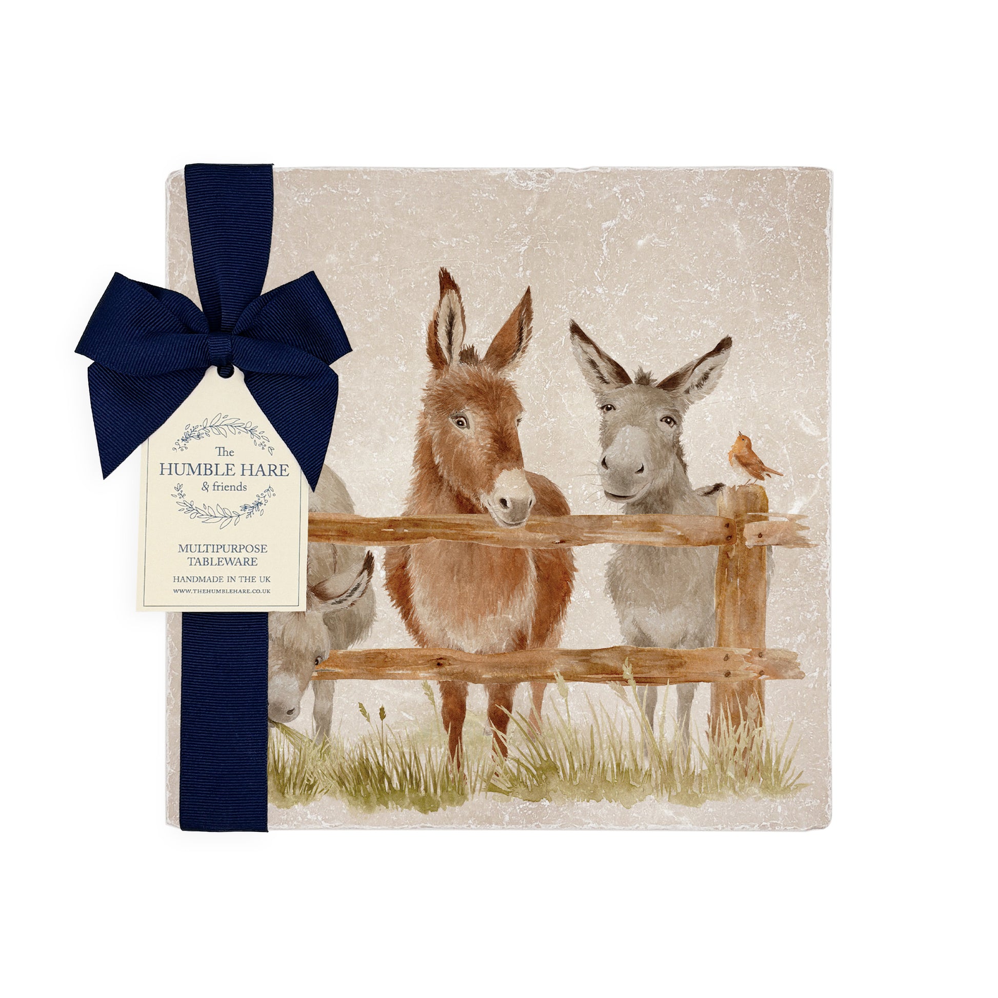 A handmade medium marble platter with a watercolour design of three donkeys and a robin lined up at a wooden fence, packaged with a luxurious dark blue bow and branded gift tag.