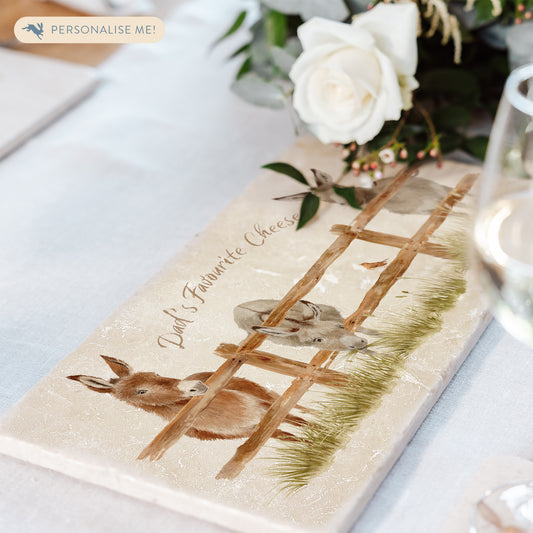 A personalised rectangular marble sharing platter featuring a herd of donkeys in a watercolour style. The example personalised neutral colour text reads ‘Dad's Favourite Cheese’ in a brush script font.