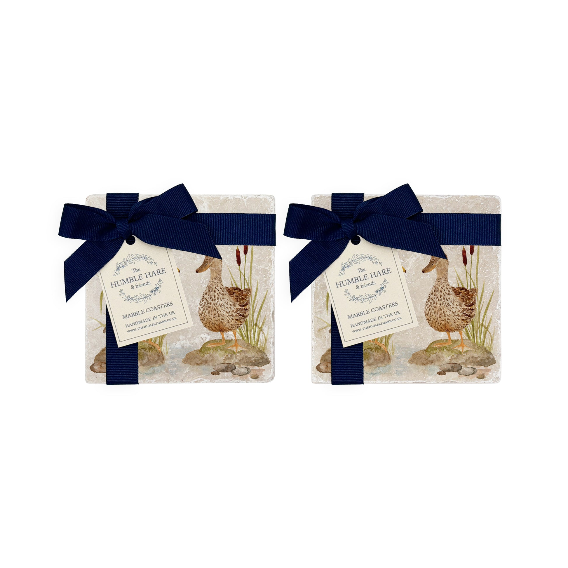 A set of 4 handmade marble coasters featuring a watercolour mallard duck design, packaged in 2 pairs, with a luxurious blue bow and gift tag.