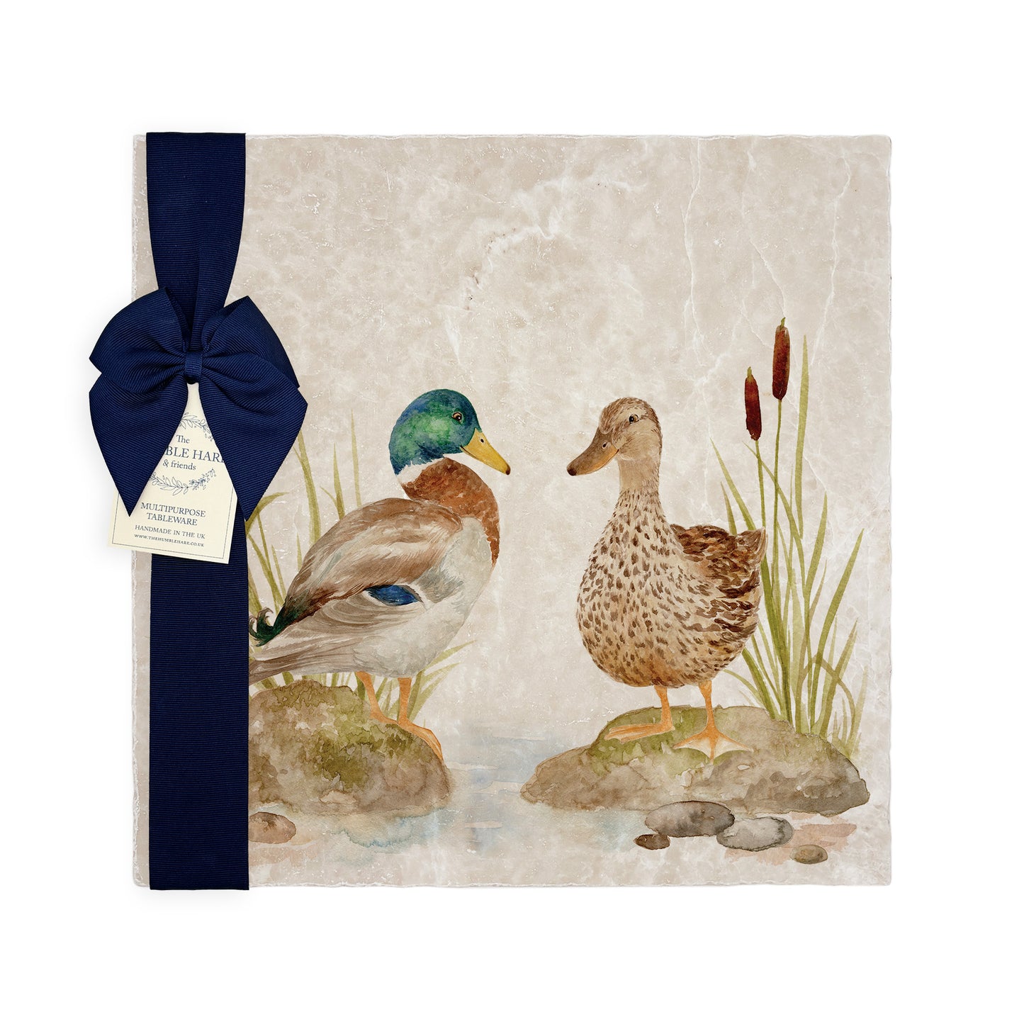 A large multipurpose marble platter with a watercolour design showing a mallard duck couple, packaged with a luxurious dark blue bow and branded gift tag.