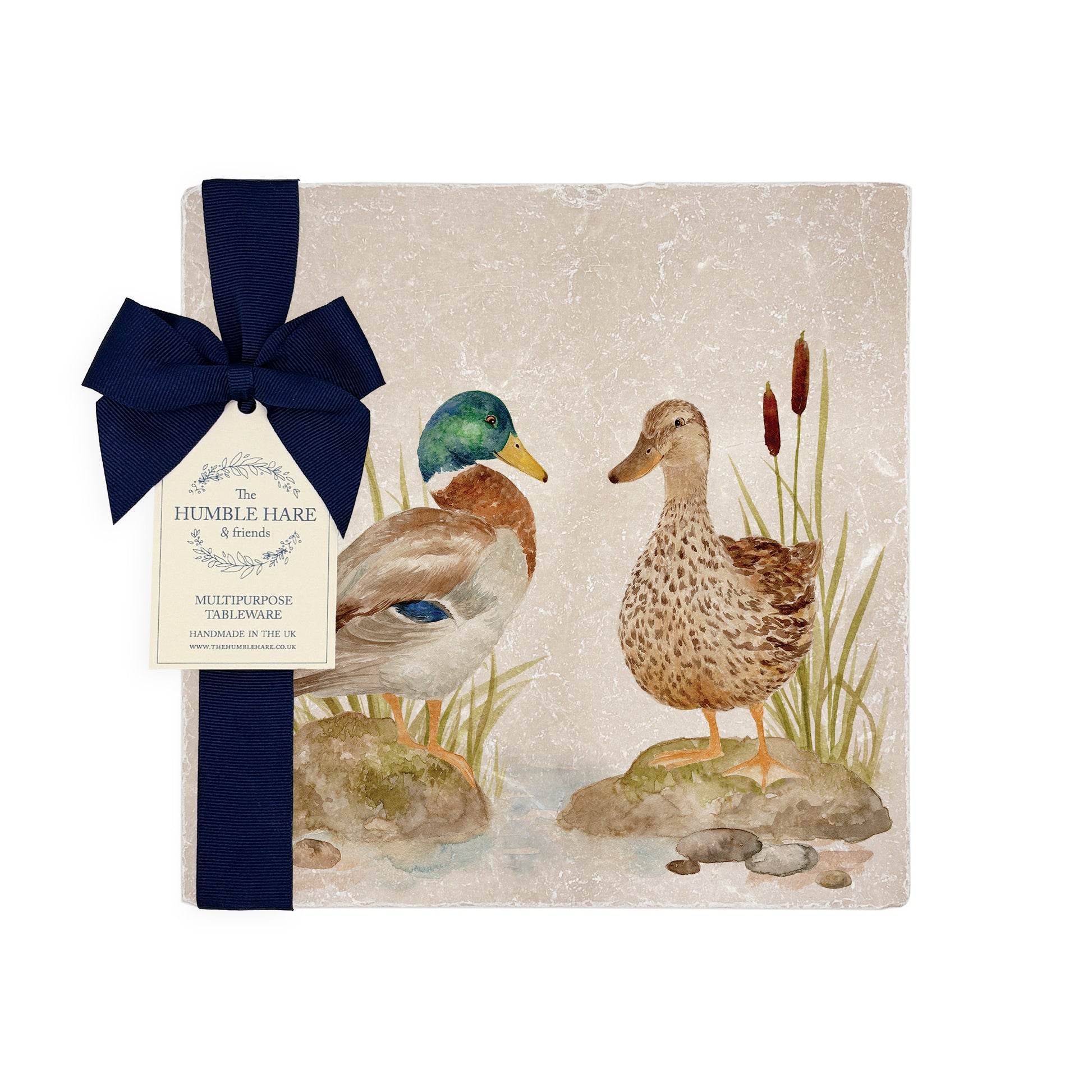 A medium multipurpose marble platter with a watercolour duck design, packaged with a luxurious dark blue bow and branded gift tag.