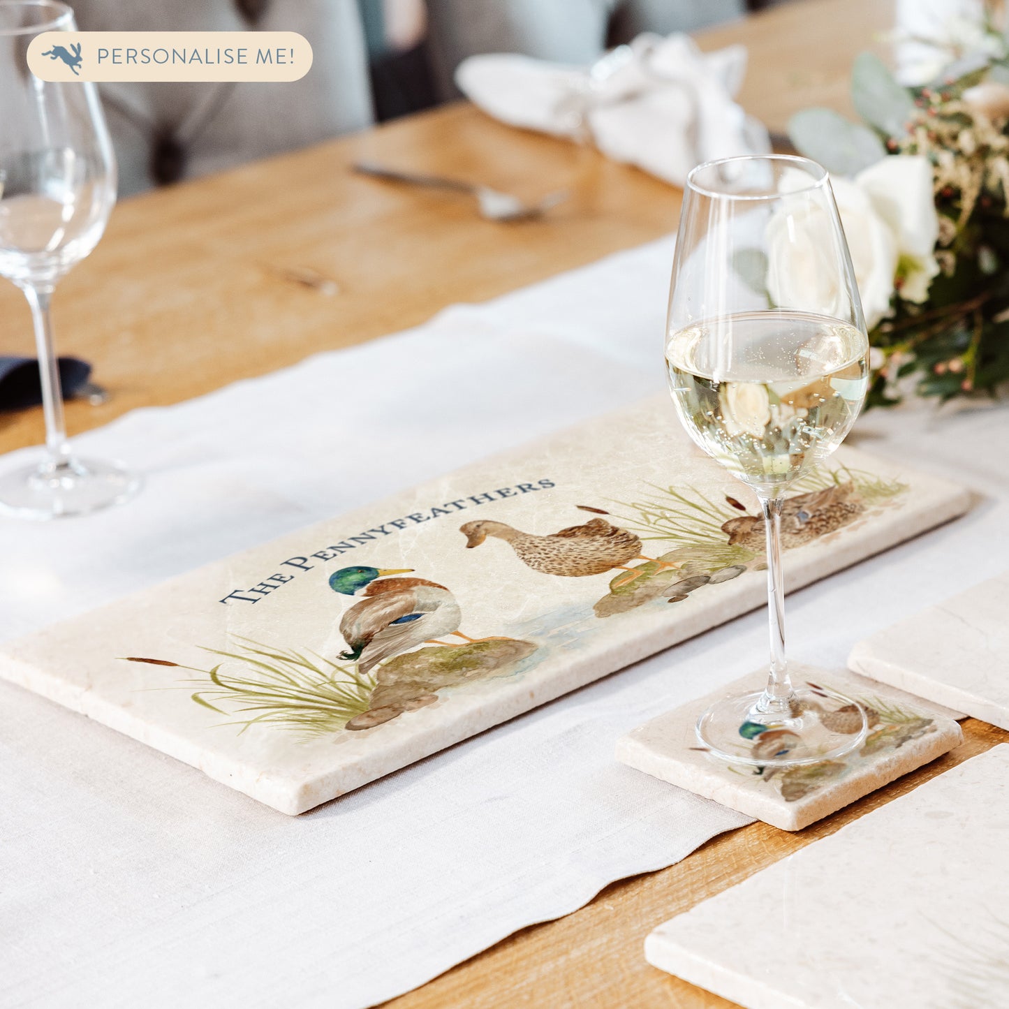 A personalised marble sharing platter set on a dining table as a centrepiece for serving dishes.