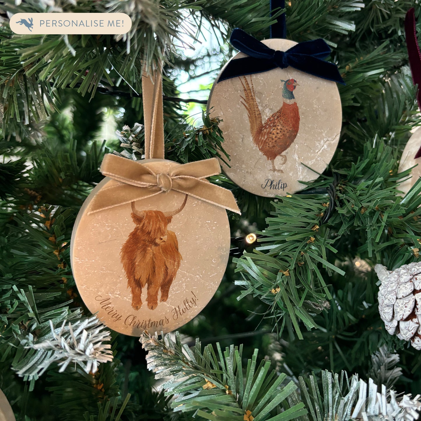 Celebrate the season in style with our oval-shaped marble baubles, featuring exquisite watercolour designs of countryside animals. Each bauble is finished with a velvet ribbon in your preferred colour and can be personalised to make your holiday décor truly unique.