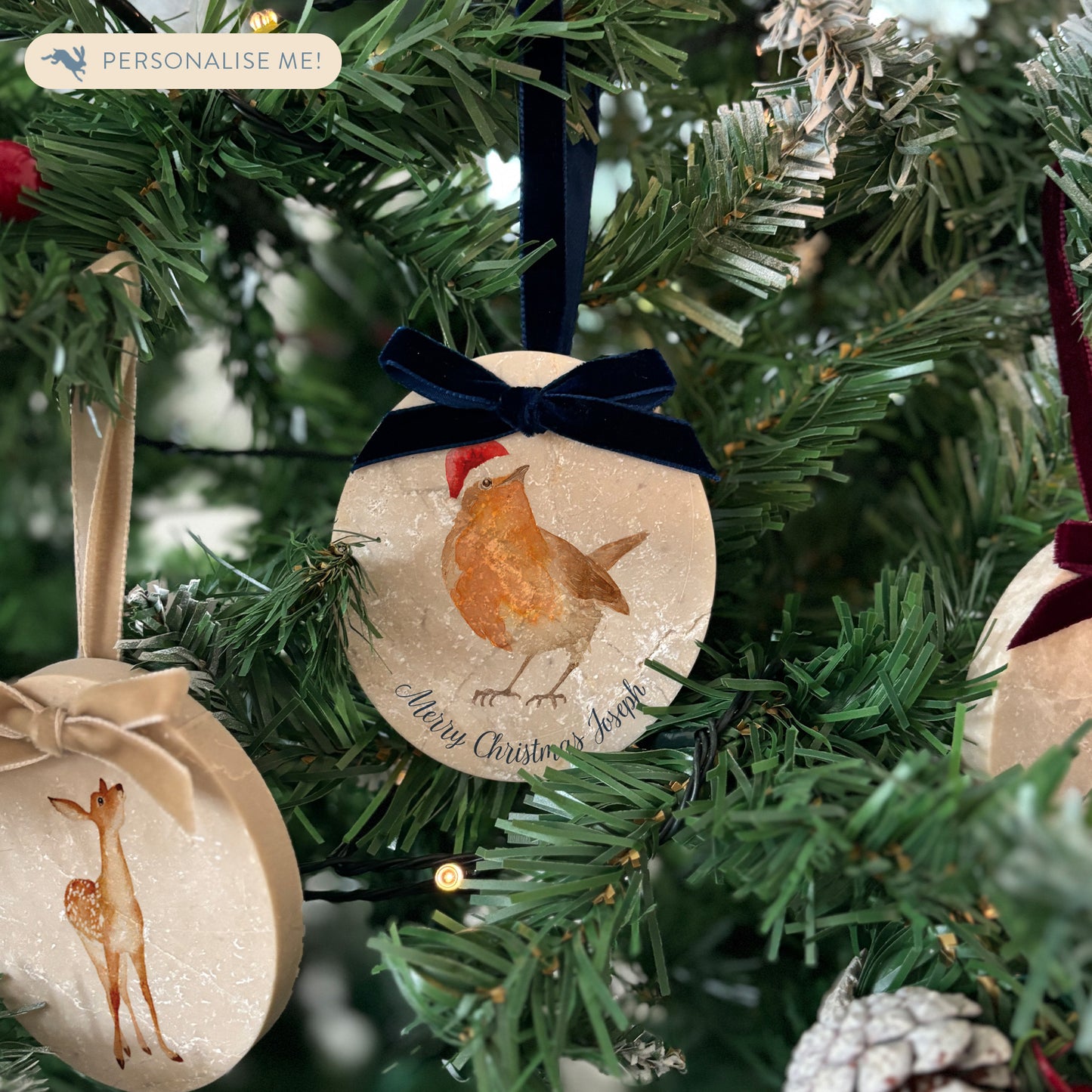 Add an elegant touch to your festive décor with our handcrafted oval-shaped marble baubles. Featuring beautiful watercolour designs of countryside animals and finished with a velvet ribbon in your choice of colour, these baubles can be personalised to reflect your unique style.
