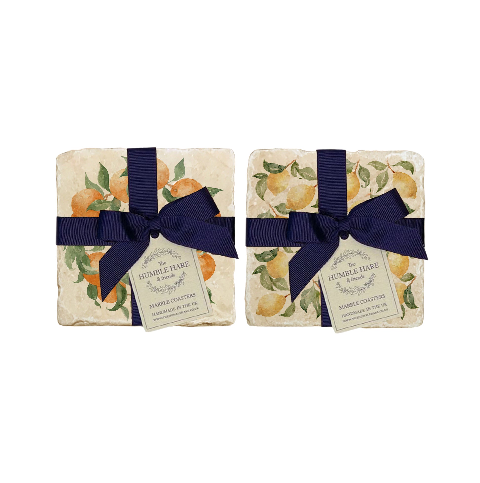 A set of 4 handmade marble coasters featuring mix and match fruit designs, packaged in 2 pairs, with a luxurious blue bow and gift tag.