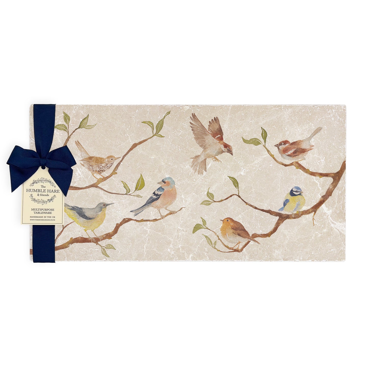 A multipurpose marble platter with a British garden birds on branches design, packaged with a luxurious dark blue bow and branded gift tag.