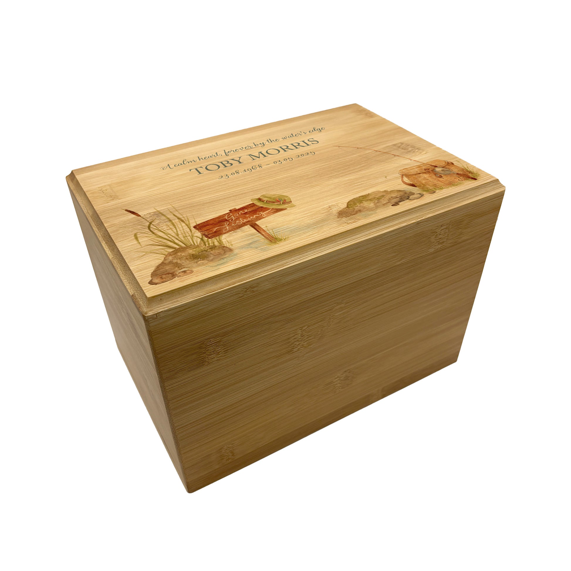A beautifully crafted solid Bamboo wooden urn, personalised and finished with a soft watercolour design of a fishing scene,  Perfect for the fishing lover- Great for Dad, Grandad, Brother, Son, Uncle.  Thoughtfully made for either display or burial, this personalised urn can be customised to create a meaningful memorial. Perfect for holding ashes of a loved one or a beloved pet, it serves as a comforting tribute and keepsake.