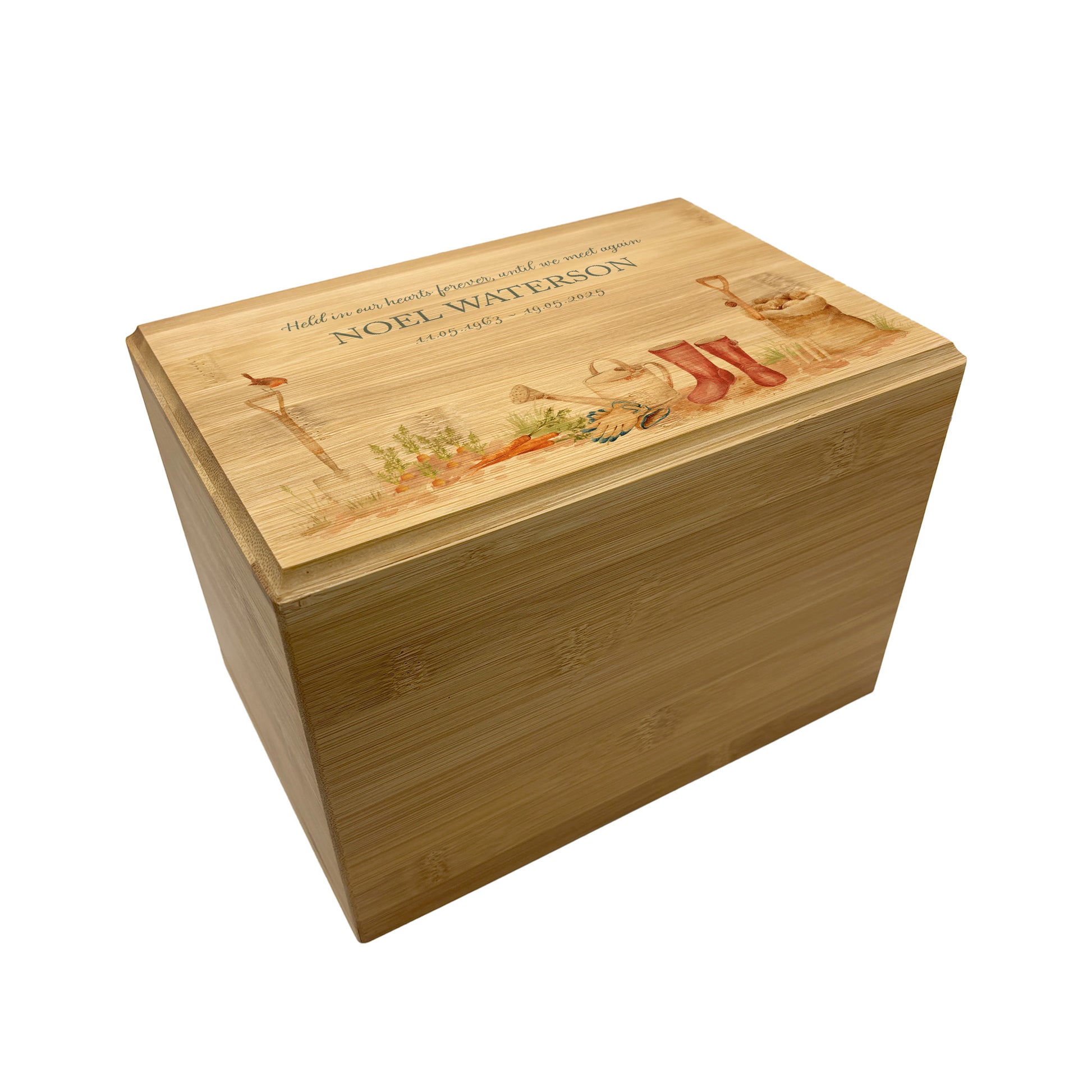 A beautifully crafted solid Bamboo wooden urn, personalised and finished with a soft watercolour design of a Gardening scene with wellies, vegetables and a robin sat on a spade. Perfect for the gardening lover Thoughtfully made for either display or burial, this personalised urn can be customised to create a meaningful memorial. Perfect for holding ashes of a loved one or a beloved pet, it serves as a comforting tribute and keepsake.