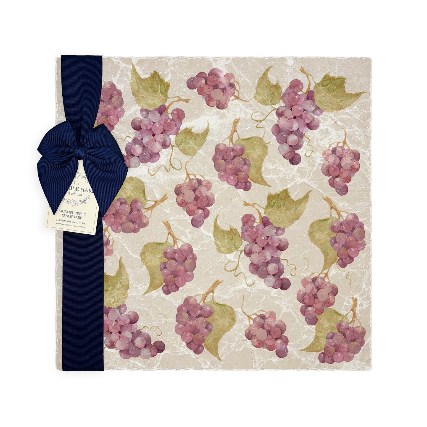 A large multipurpose marble platter with a watercolour grape vine pattern, packaged with a luxurious dark blue bow and branded gift tag.