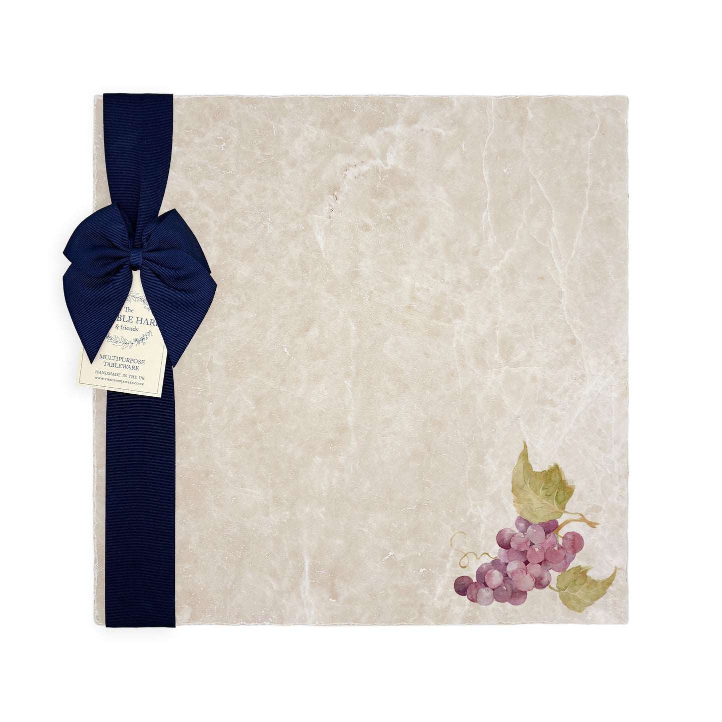 A large multipurpose marble platter with a watercolour grape vine design, packaged with a luxurious dark blue bow and branded gift tag.