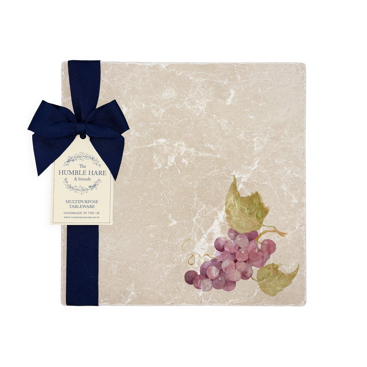 A medium multipurpose marble platter with a watercolour grape vine design, packaged with a luxurious dark blue bow and branded gift tag.