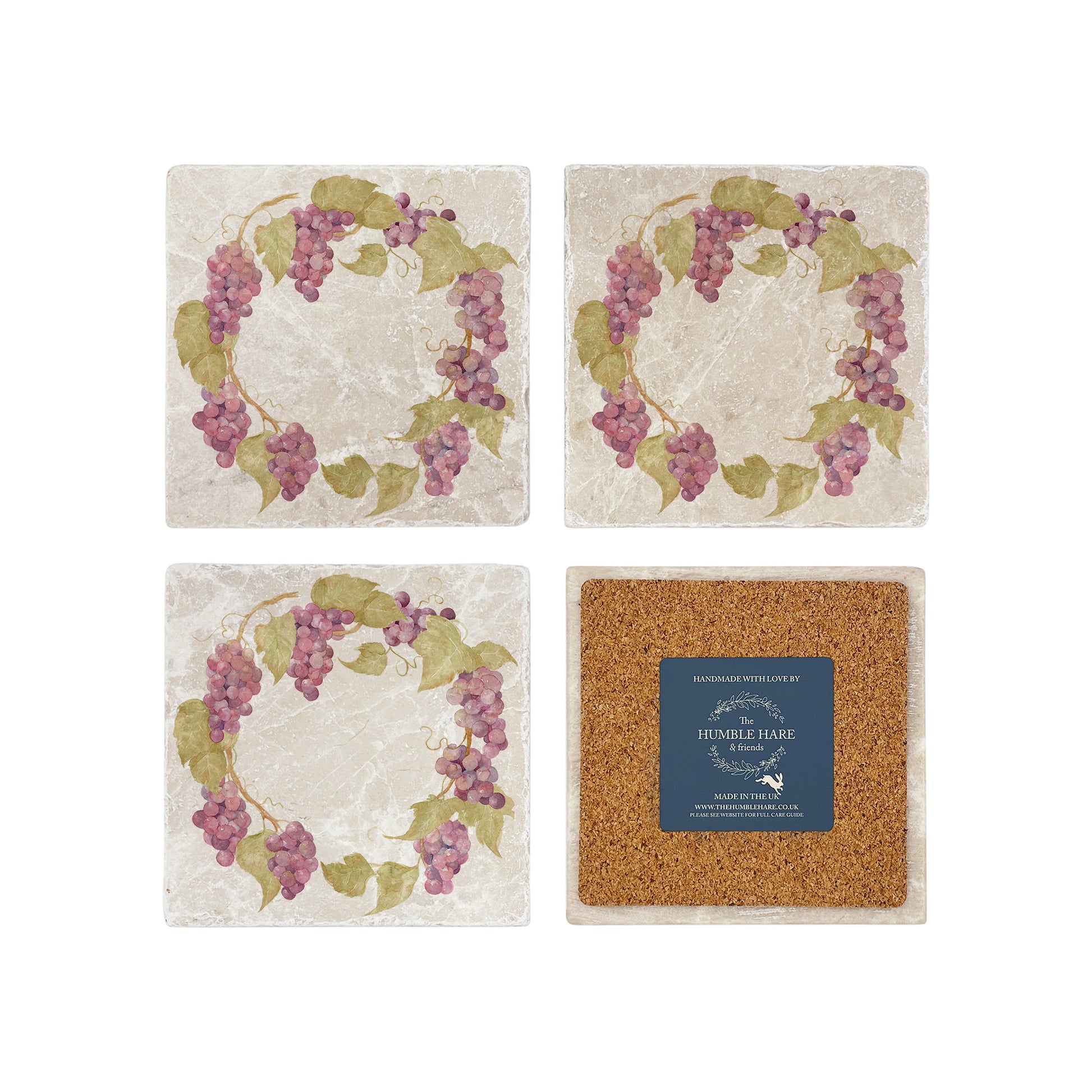A set of 4 square marble coasters, featuring a watercolour grape vine wreath design. One coaster is flipped to show that the coasters are backed with cork.