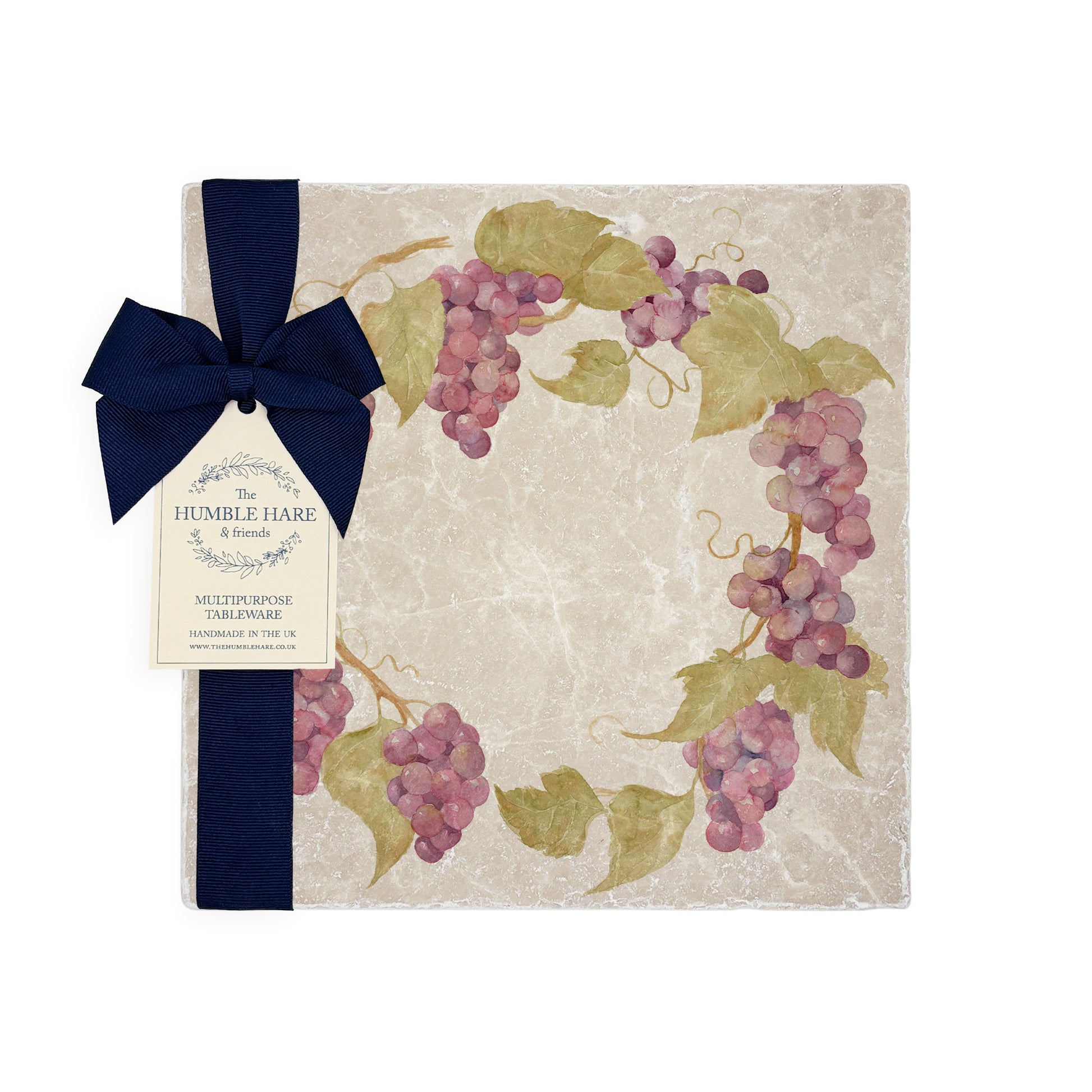 A medium multipurpose marble platter with a watercolour grape vine wreath design, packaged with a luxurious dark blue bow and branded gift tag.
