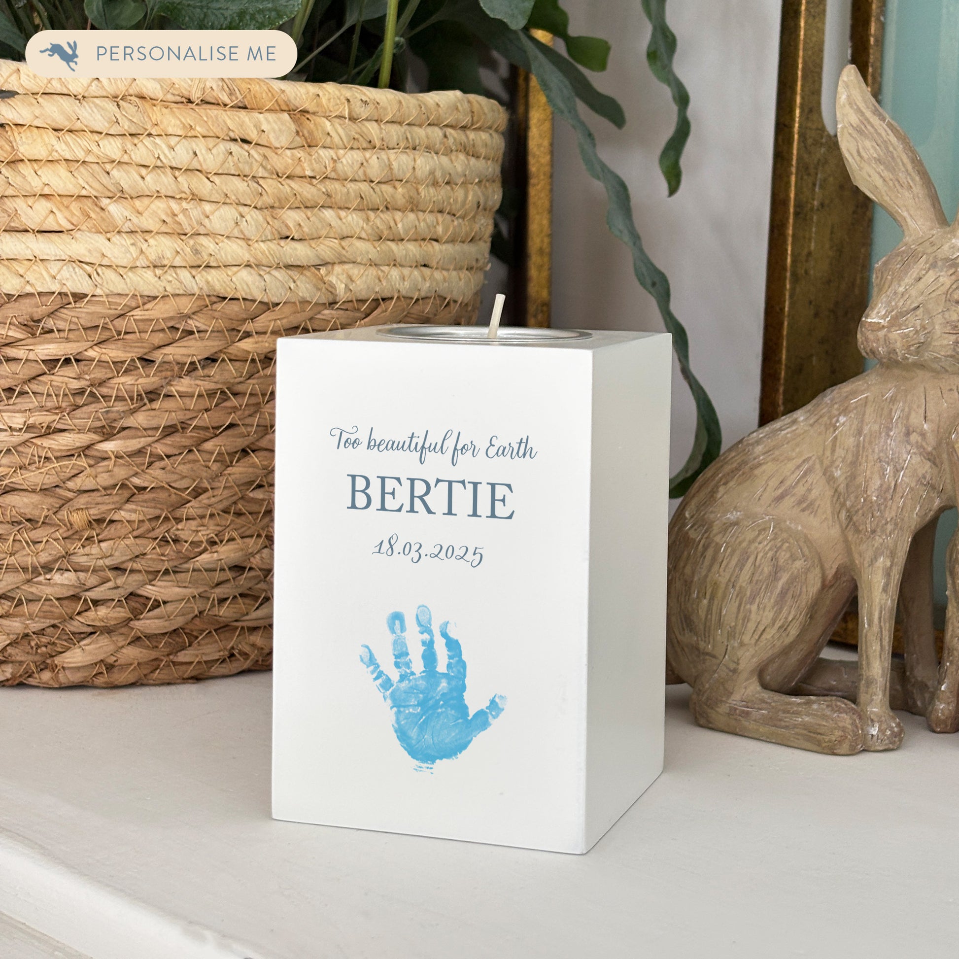 A beautifully crafted wooden tealight holder, finished in white with a soft watercolour design of baby's handprints and footprints, Thoughtfully made for display and to light in memory of a loved one this personalised tealight hold/candle can be customised to create a meaningful memorial.  it serves as a comforting tribute and keepsake. Helping with baby loss