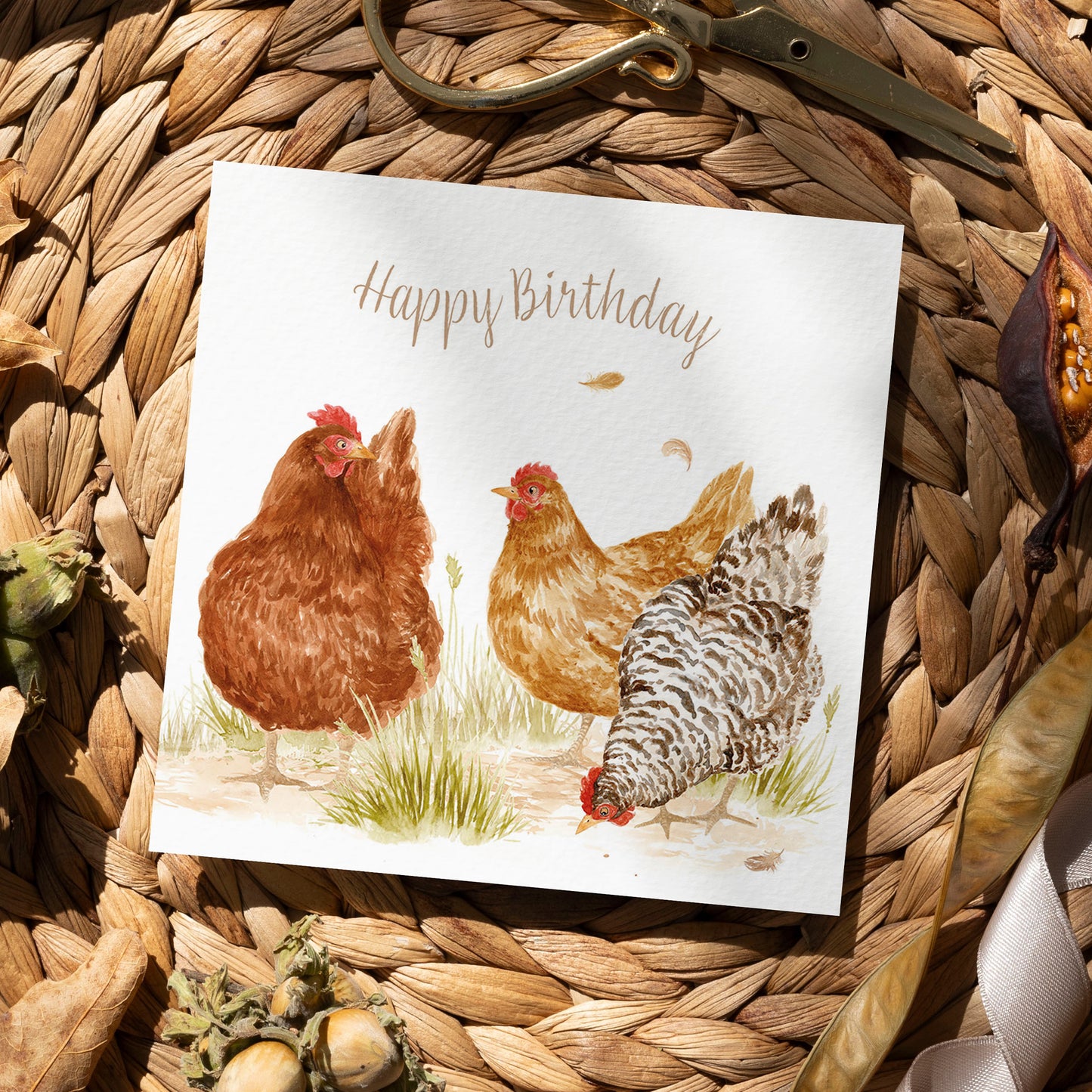 A bookmark greetings card with a watercolour design of three hens that reads 'Happy Birthday'.