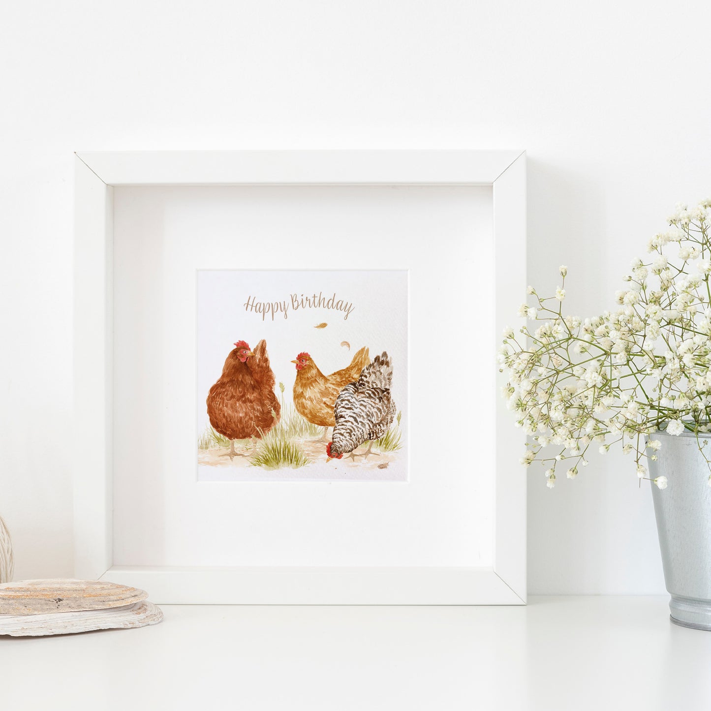 A framed bookmark greetings card with a watercolour design of three hens that reads 'Happy Birthday'.