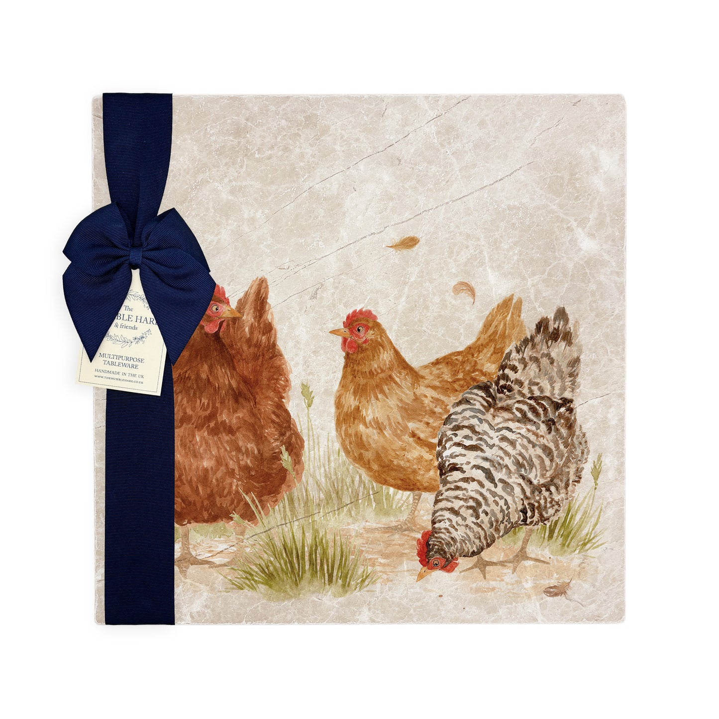 A large multipurpose marble platter with a watercolour hen design, packaged with a luxurious dark blue bow and branded gift tag.