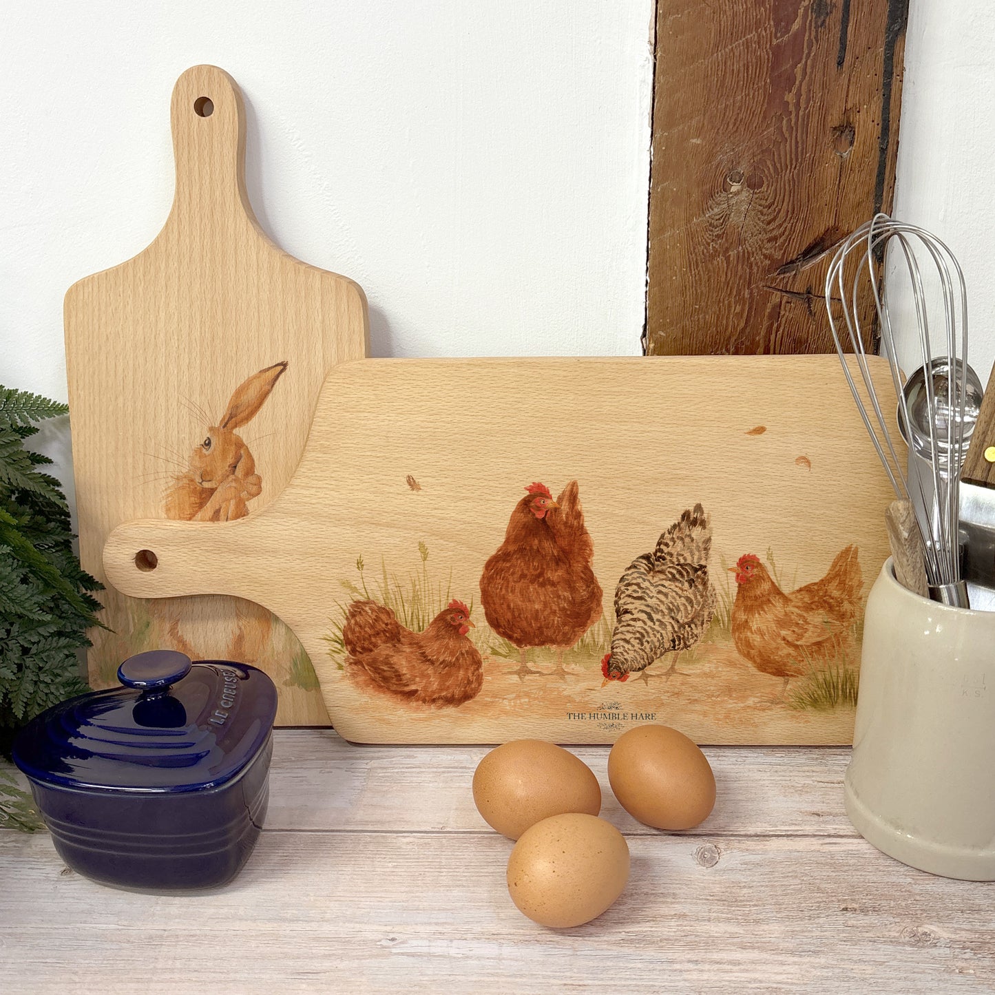 Handmade paddle board in Beech wood, featuring a water colour Hen design with a hand tied luxury blue ribbon. perfect chopping board, charcuterie board, serving board and chopping board.