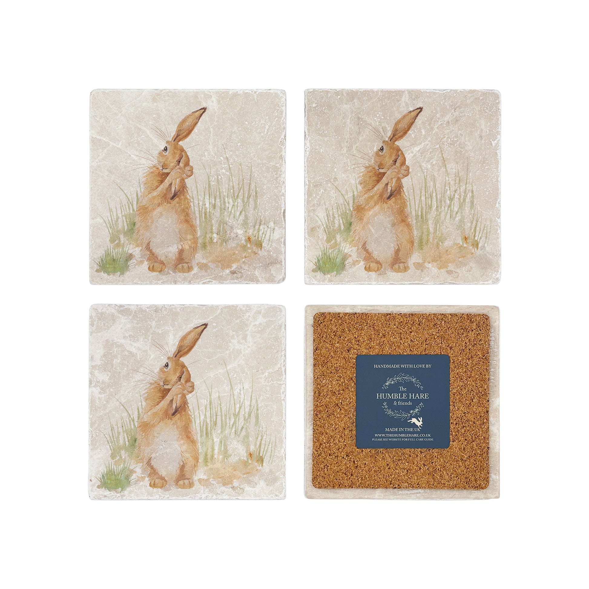 A set of 4 square marble coasters, featuring a watercolour design of a hare washing his ear in the English countryside. One coaster is flipped to show that the coasters are backed with cork.