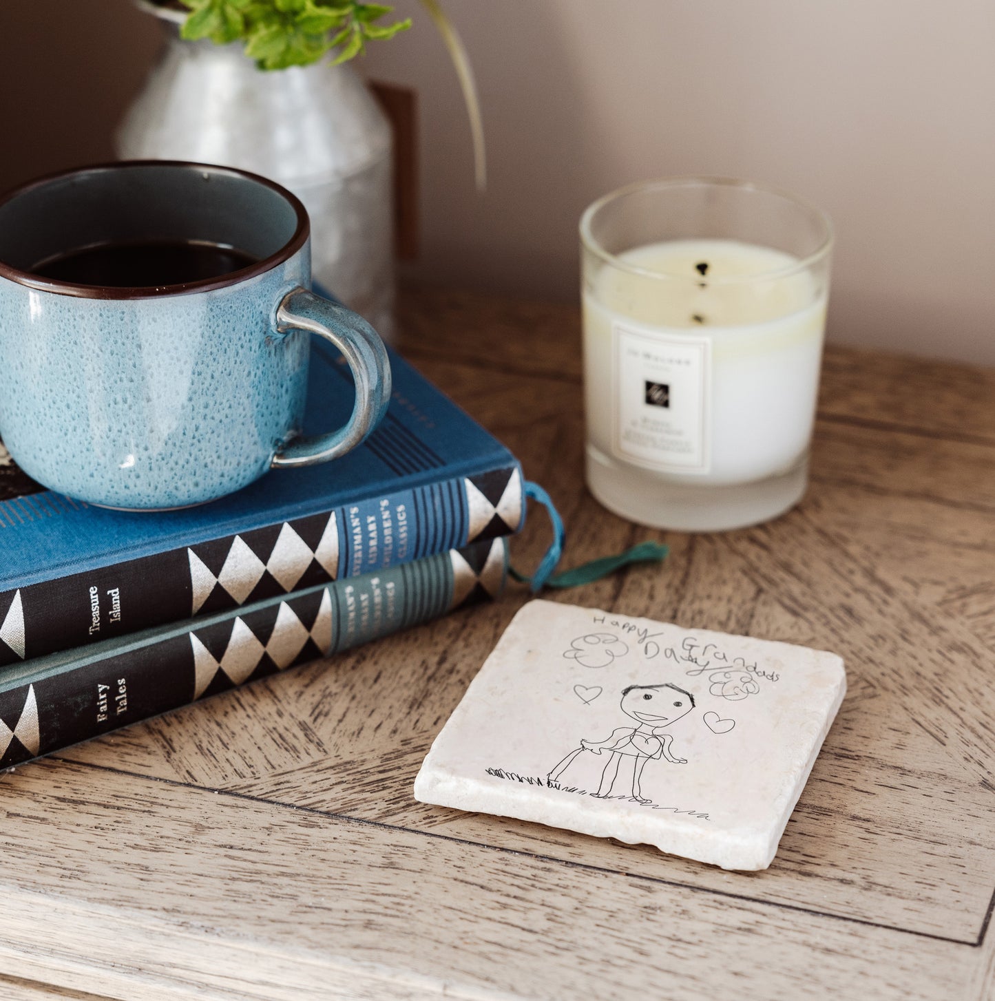 A handmade marble coaster personalised with a child's drawing. A unique keepsake gift for parents and grandparents.