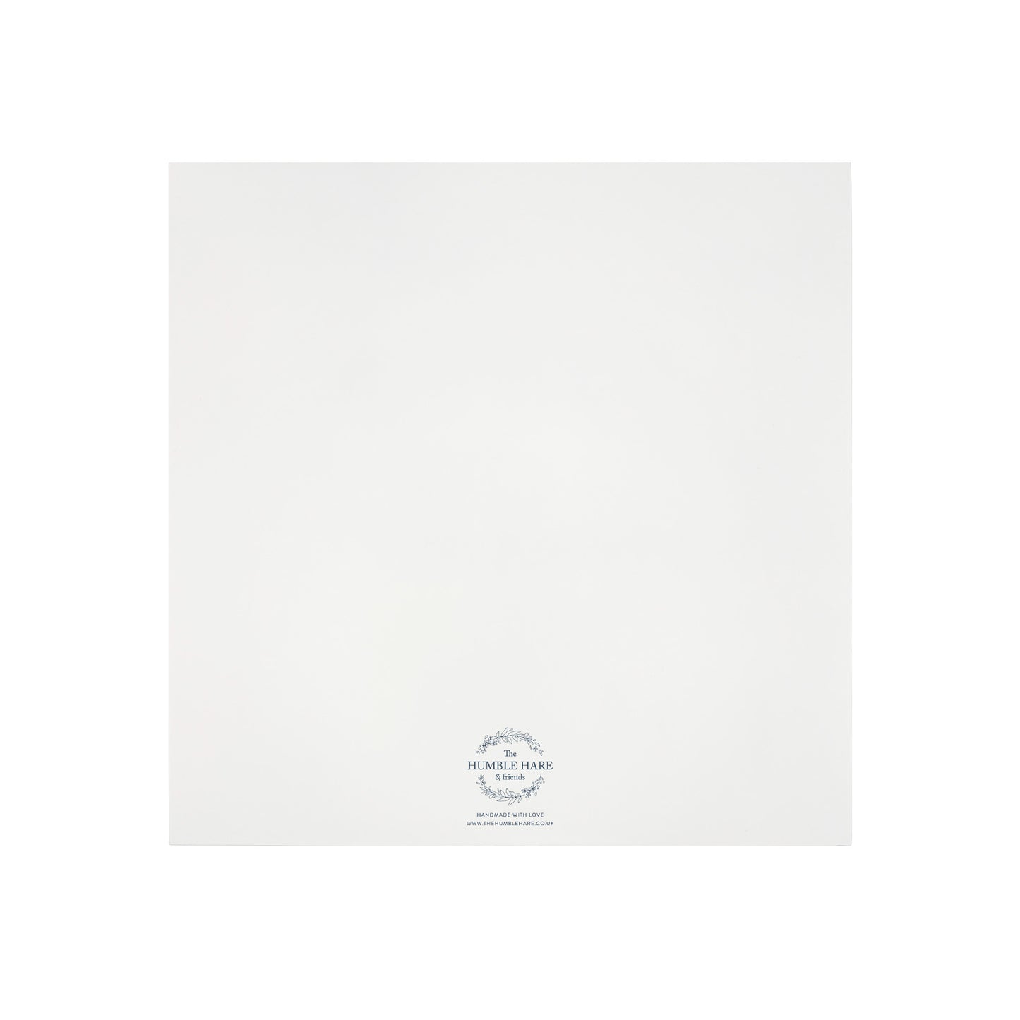 The bottom of a white wooden keepsake gift box showing The Humble Hare logo.
