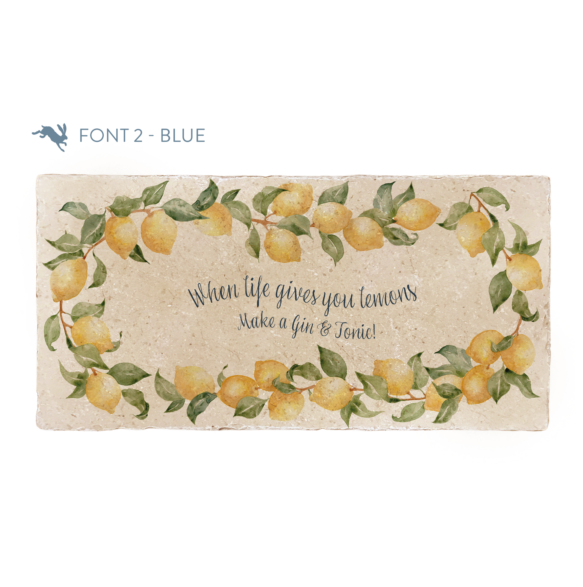 A marble sharing platter featuring a wreath of lemons and leaves, personalised with the bespoke message ‘When life gives you lemons make a gin & tonic’ in the centre of the platter in a blue calligraphy font.