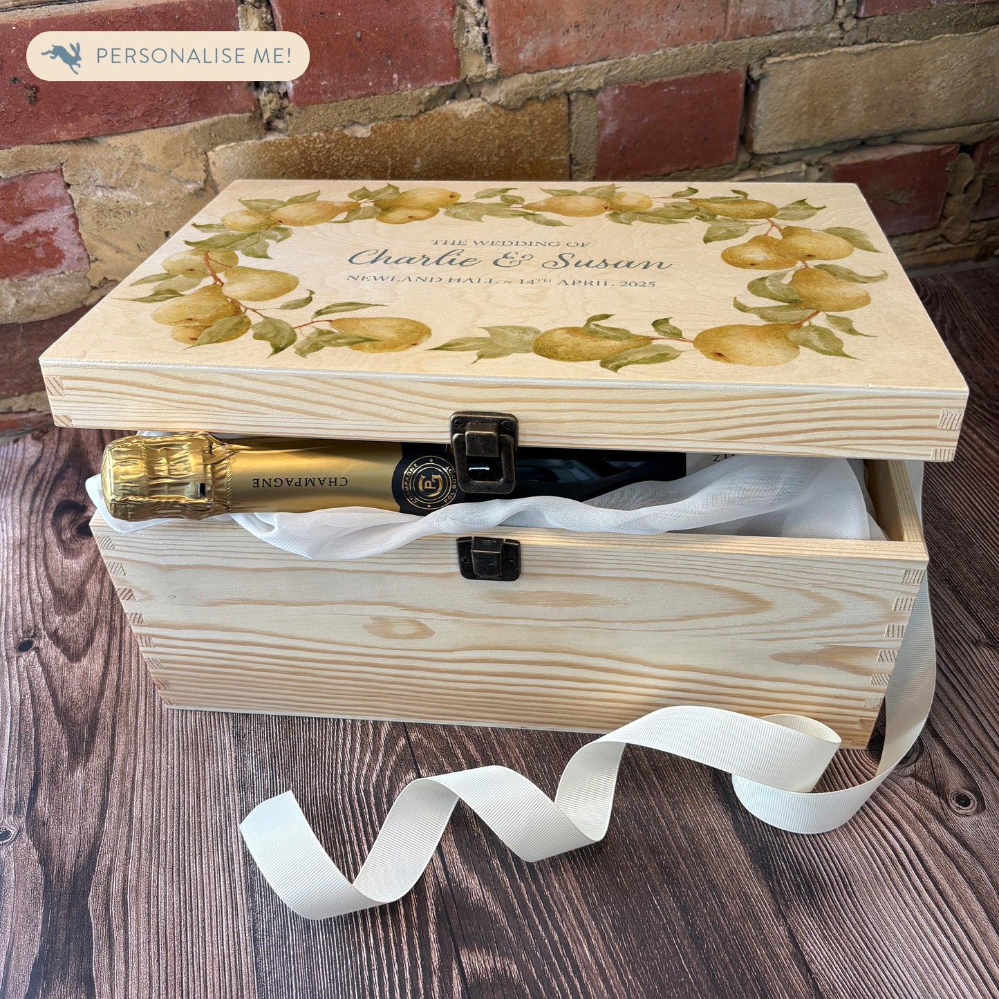 Large Pear wreath Personalised wedding keepsake box with vibrant watercolour fruit design, featuring the couple’s names and wedding date on natural pine wood. This box can be customised and is a truly unique wedding & Anniversary gift. Example shown of how you can fill your special box with gifts for the Bride and Groom