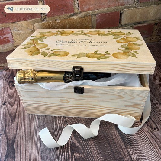 Large Pear wreath Personalised wedding keepsake box with vibrant watercolour fruit design, featuring the couple’s names and wedding date on natural pine wood. This box can be customised and is a truly unique wedding & Anniversary gift.  Example shown of how you can fill your special box with gifts for the Bride and Groom