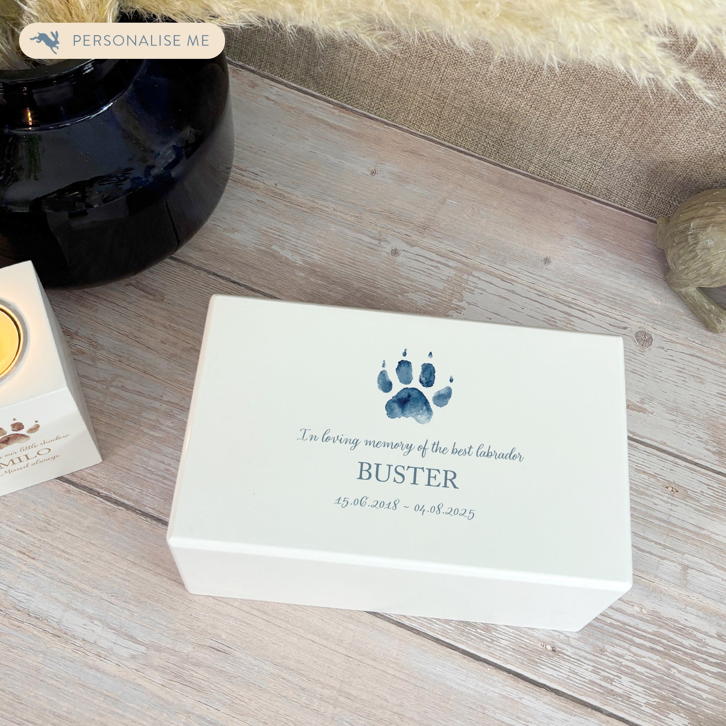 A beautifully crafted solid wooden urn, finished in white with a soft watercolour design of your cat or dogs paw print, Thoughtfully made for either display or burial, this personalised urn can be customised to create a meaningful memorial. Perfect for holding ashes of a beloved pet, it serves as a comforting tribute and keepsake.
