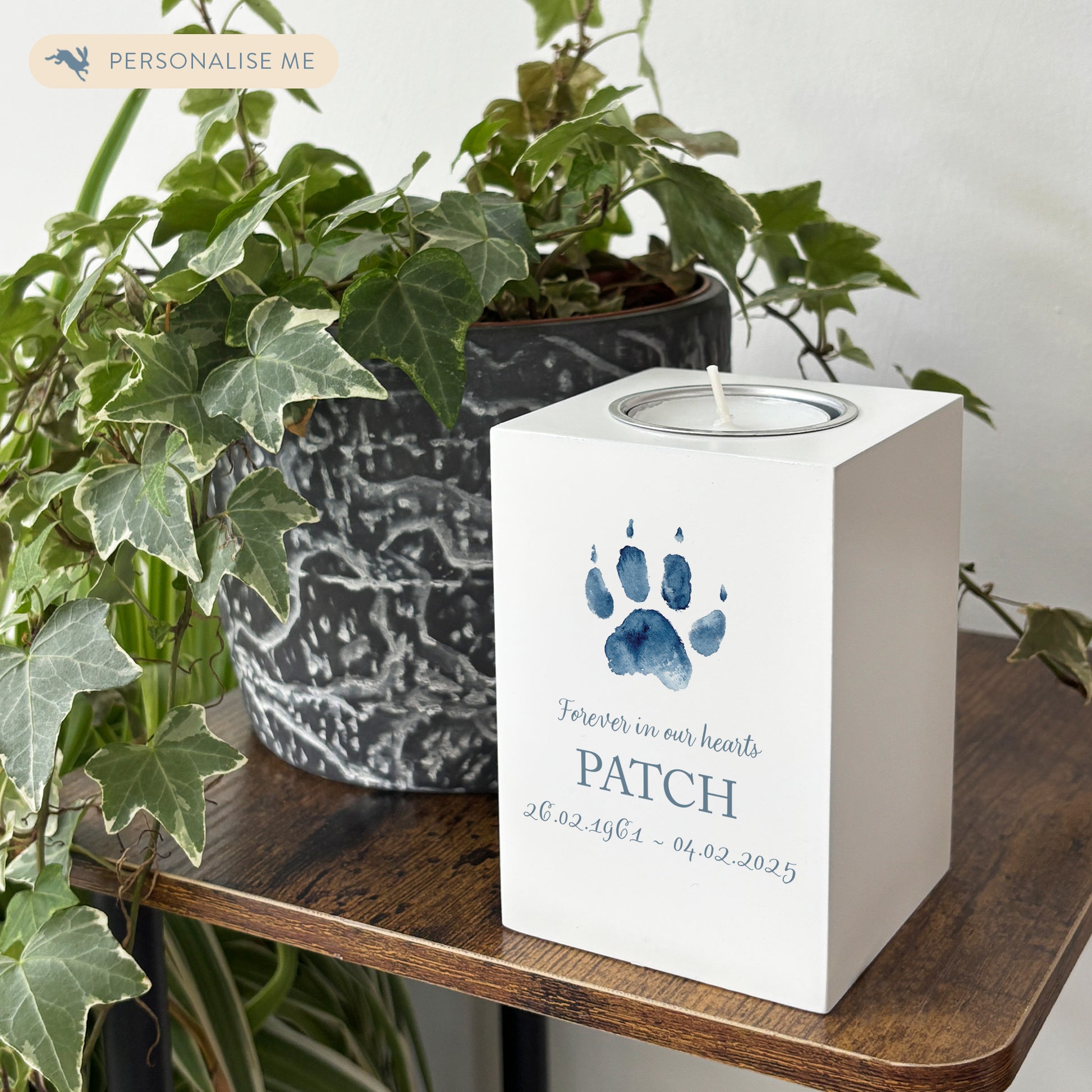 A beautifully crafted solid wooden tealight holder finished in white with a soft watercolour design of your cat or dogs paw print, personalised tealight holder can be customised to create a meaningful memorial.