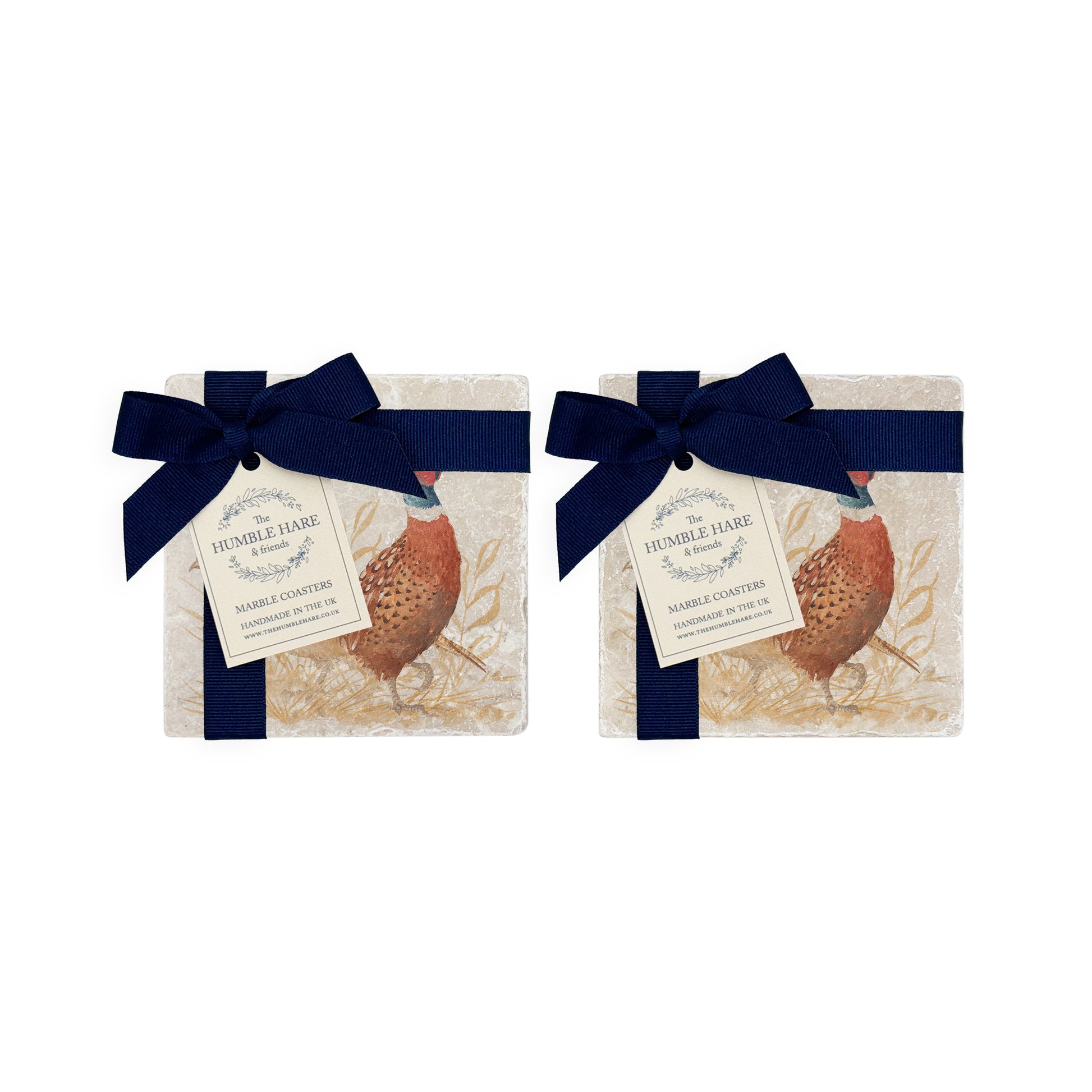A set of 4 handmade marble coasters featuring a watercolour pheasant design, packaged in 2 pairs, with a luxurious blue bow and gift tag.