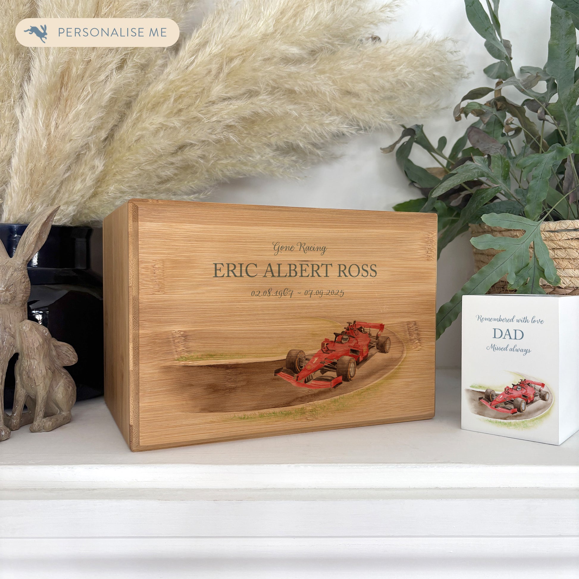 A beautifully crafted solid Bamboo wooden urn, personalised and finished with a soft watercolour design of a race car on a track, for the person who loved cars and all things racing. Great for Dad, Grandad, Brother, Son, Uncle.  Thoughtfully made for either display or burial, this personalised urn can be customised to create a meaningful memorial. Perfect for holding ashes of a loved one or a beloved pet, it serves as a comforting tribute and keepsake.