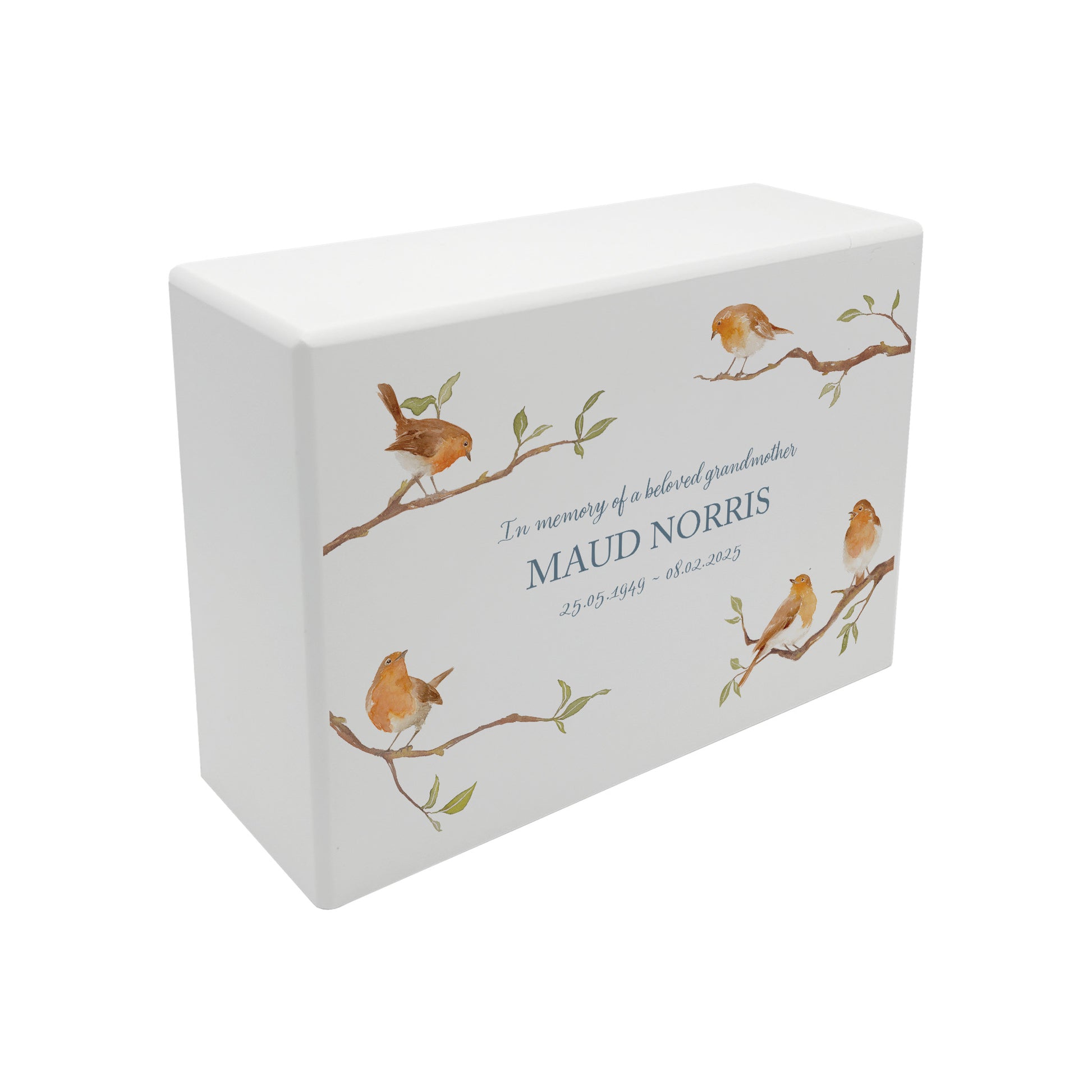 A beautifully crafted solid wooden urn, finished in white with a soft watercolour design of Robins on Branches,  Thoughtfully made for either display or burial, this personalised urn can be customised to create a meaningful memorial. Perfect for holding ashes of a loved one or a beloved pet, it serves as a comforting tribute and keepsake.