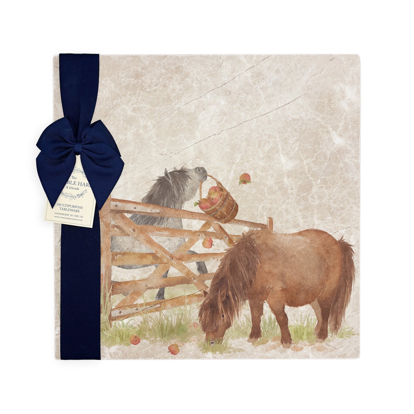 A multipurpose marble platter with a watercolour Shetland pony design, packaged with a luxurious dark blue bow and branded gift tag.