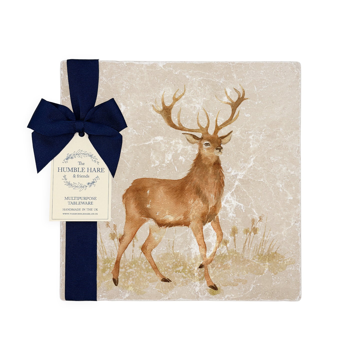 A square medium marble platter featuring a majestic stag in a watercolour style, packaged with a luxurious blue bow and gift tag.