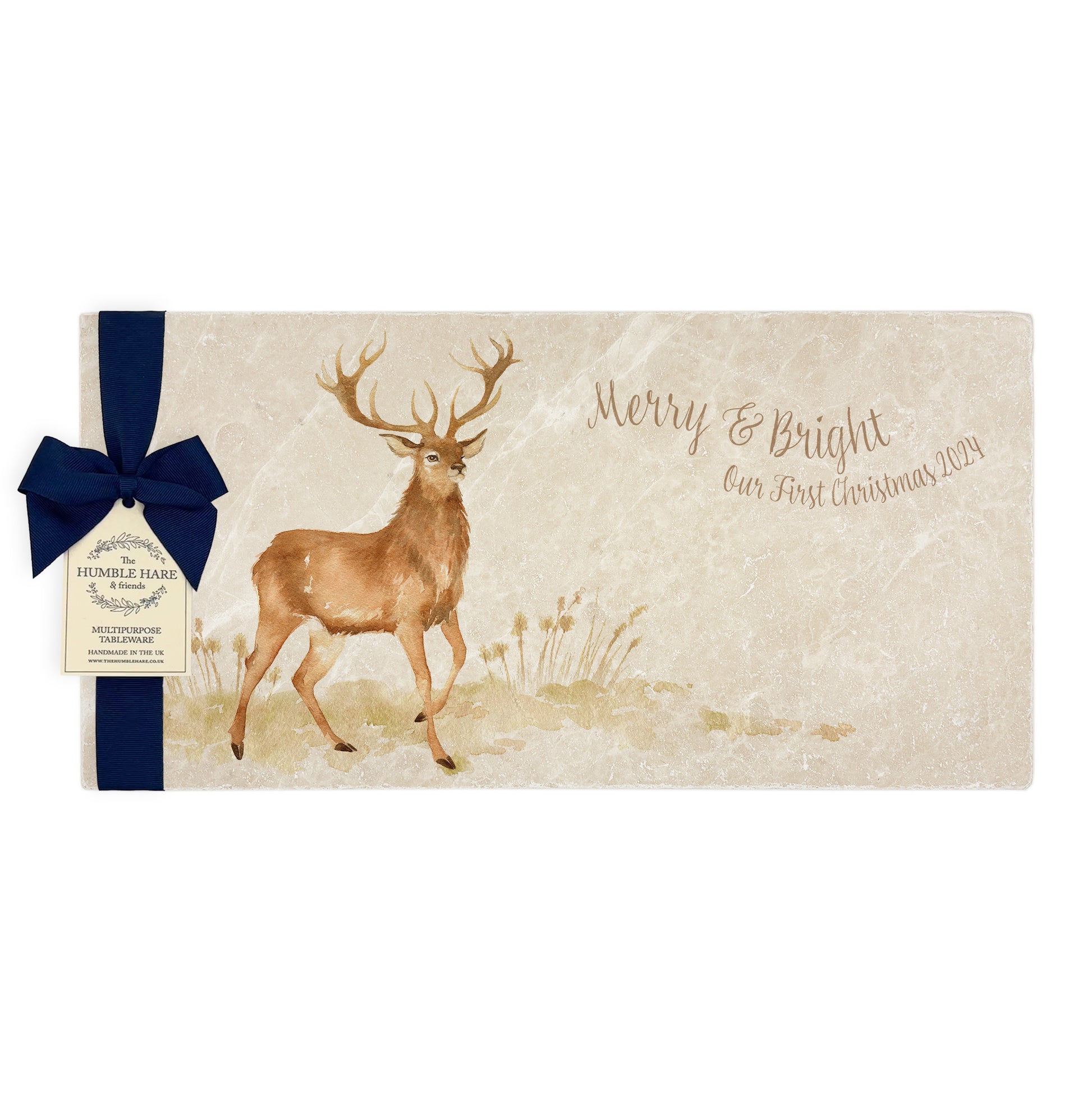 A personalised marble sharing platter featuring a stag in a watercolour style, packaged with a luxurious dark blue bow and branded gift tag.