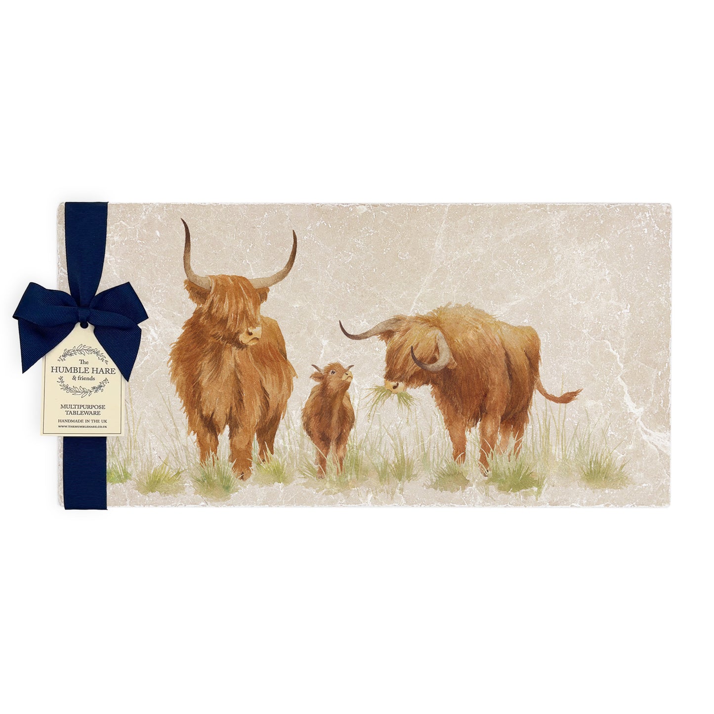 A multipurpose marble sharing platter with a highland cow and calf design, packaged with a luxurious dark blue bow and branded gift tag.