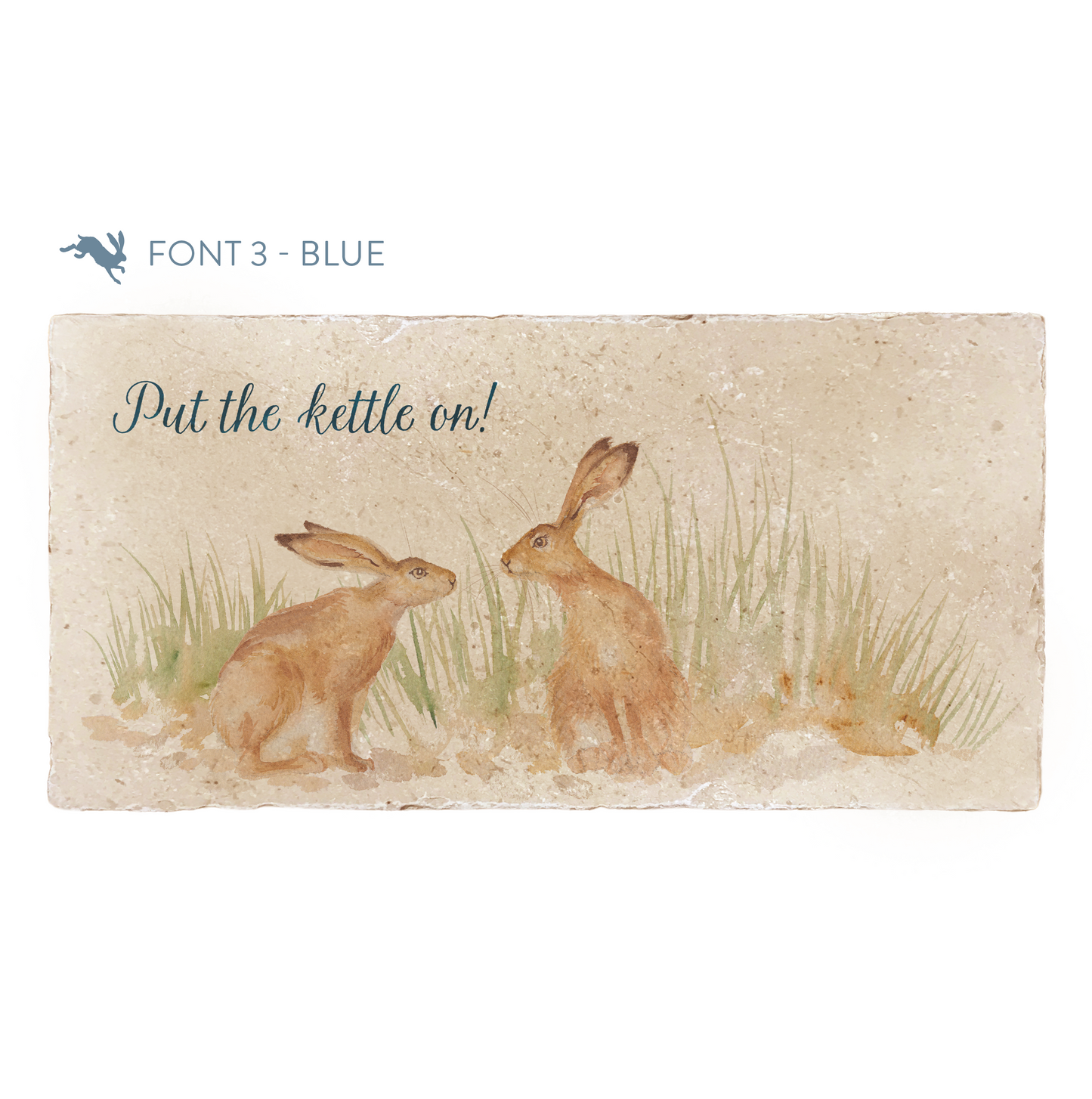 A personalised rectangular marble sharing platter featuring a two kissing hares in a watercolour style. The example personalised dark blue text reads ‘Put the kettle on! in a modern script font.