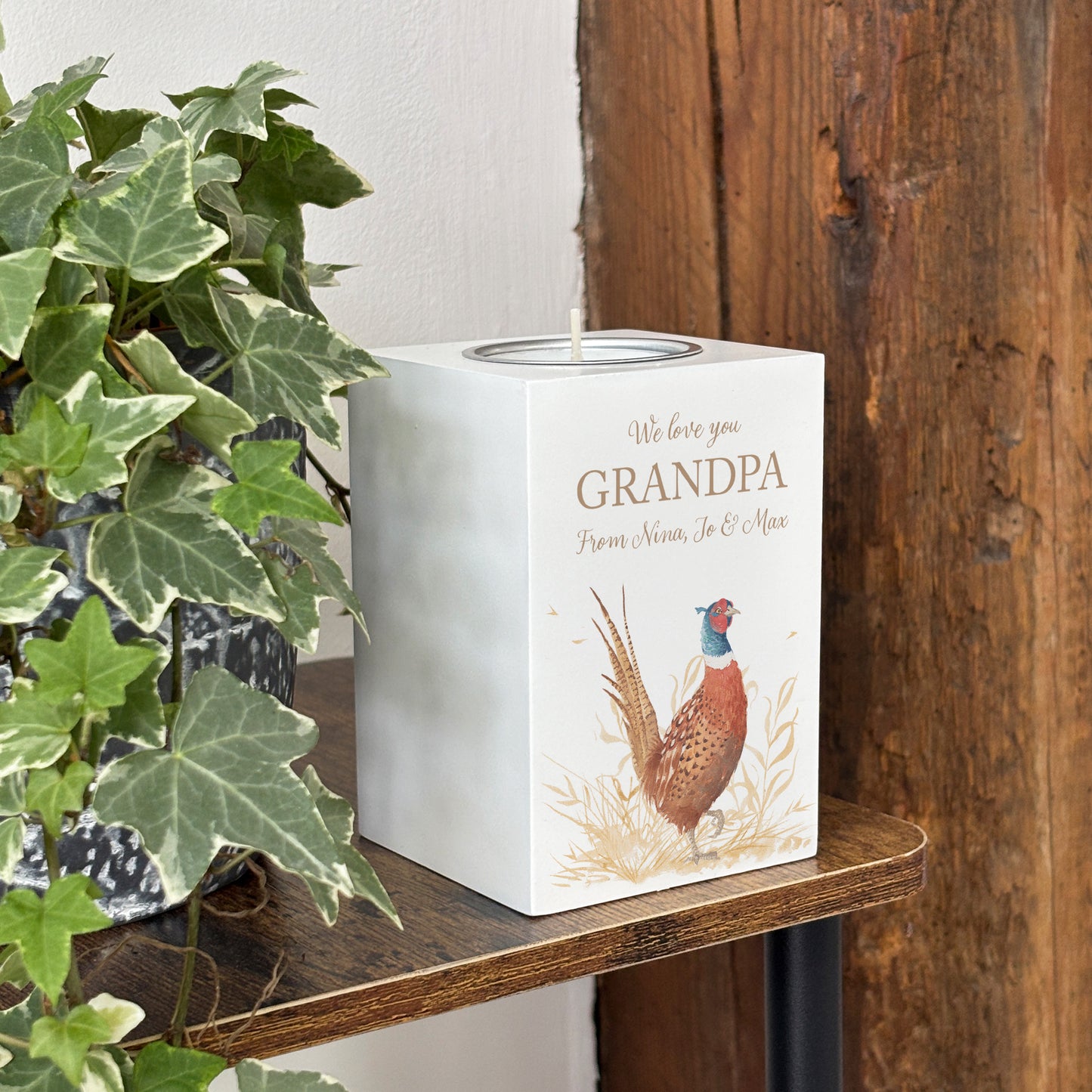 wooden cuboid luxury tealight holder with gorgeous personalised options . Each product is lovingly designed, handmade with our Countryside inspired watercolour designs. This design features a vibrant male pheasant and a farmers crop field. unique designs for a truly one off special occasion for a loved one.