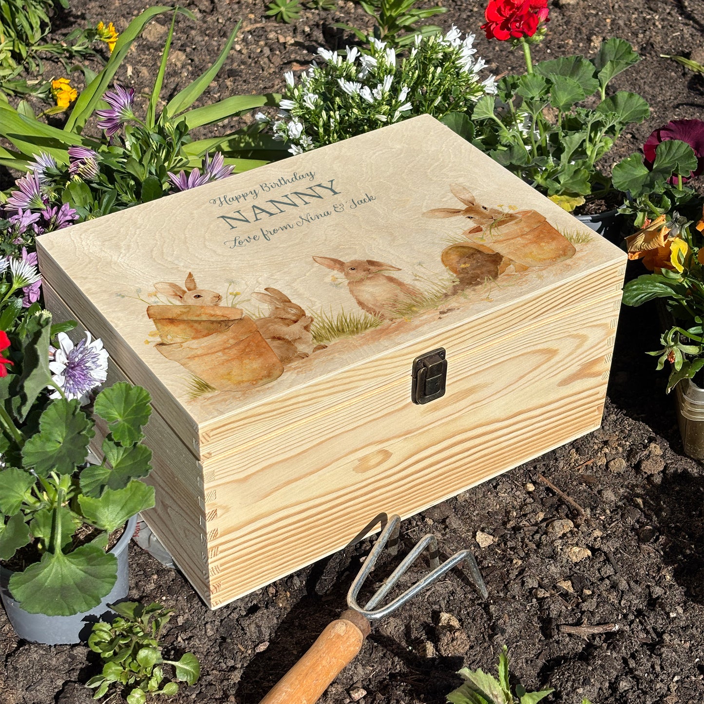 Large wooden pine gift box, The perfect Personalised keepsake, memory box, storage box with lots of Bunnies ain pots holding bunches of flowers in their mouths in a classic gentle watercolour style. Personalise for Nanny, grandad, mum and dad
