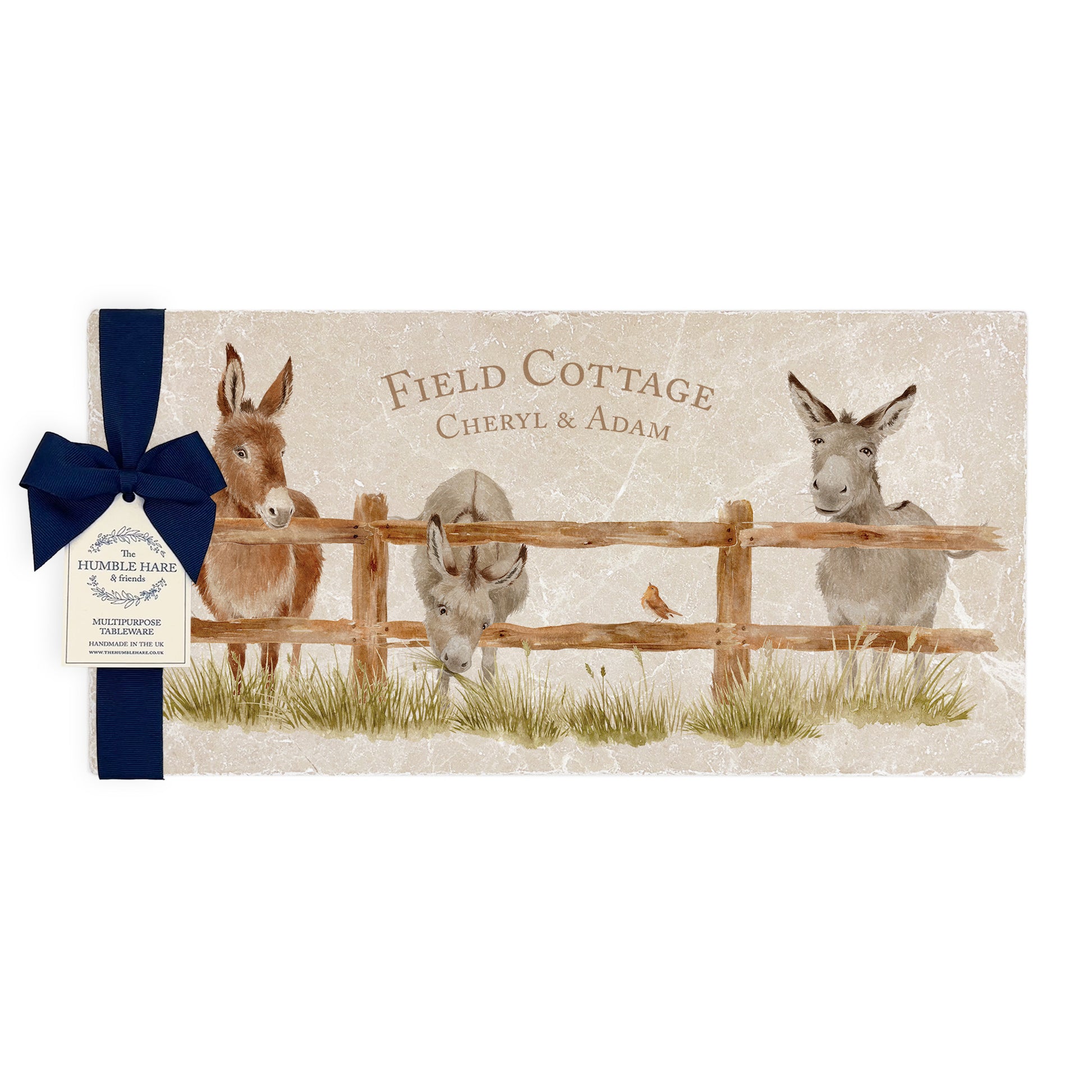 A personalised rectangular marble sharing platter featuring a herd of donkeys in a watercolour style. The bespoke gift is packaged with a luxurious dark blue bow and branded gift tag.